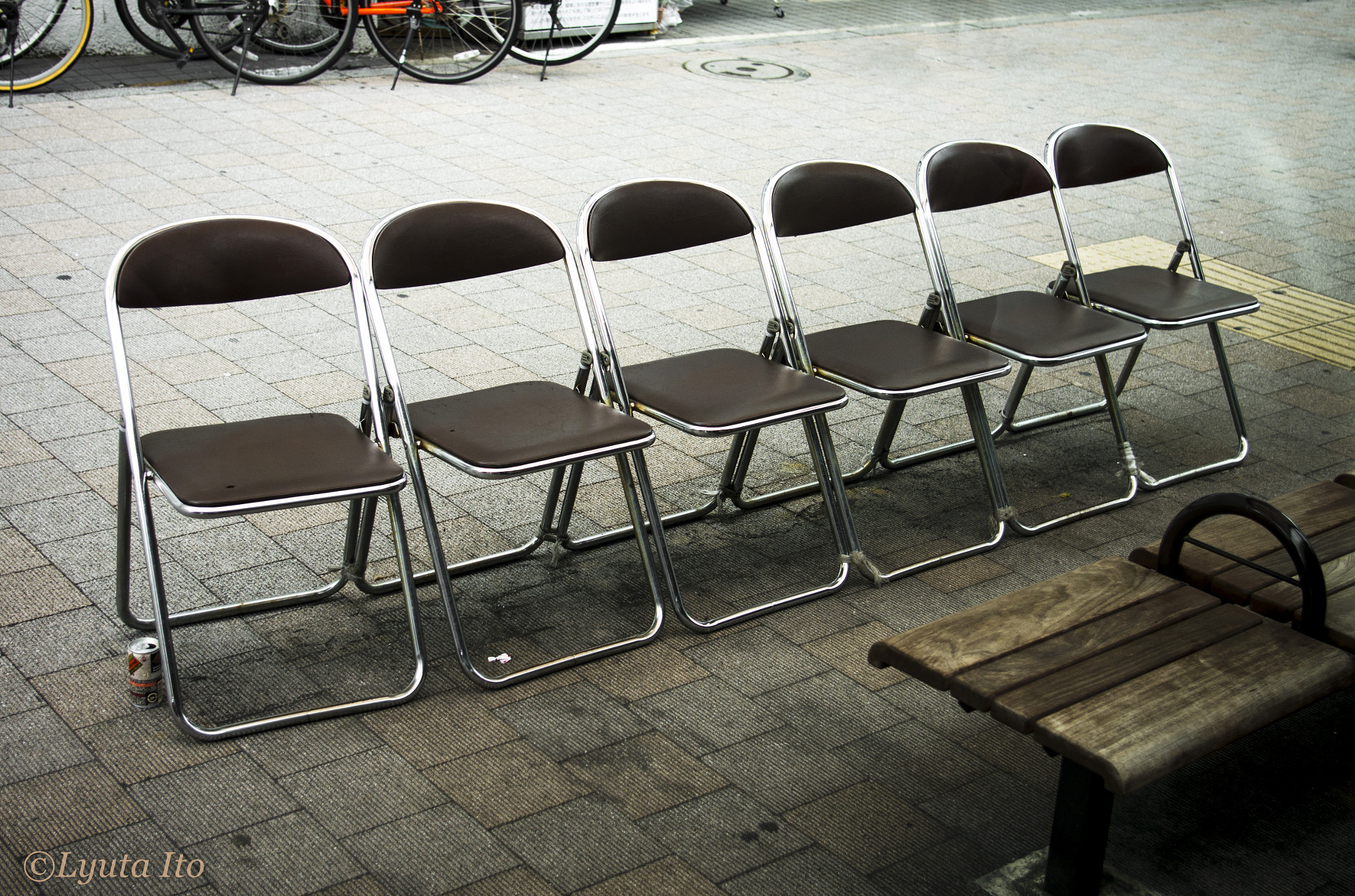 Pentax K-5 sample photo. Chairs at a bus stop photography