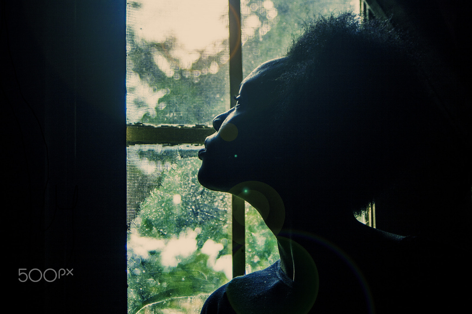 Canon EF 28-80mm f/3.5-5.6 USM sample photo. Girl looking out side a window photography