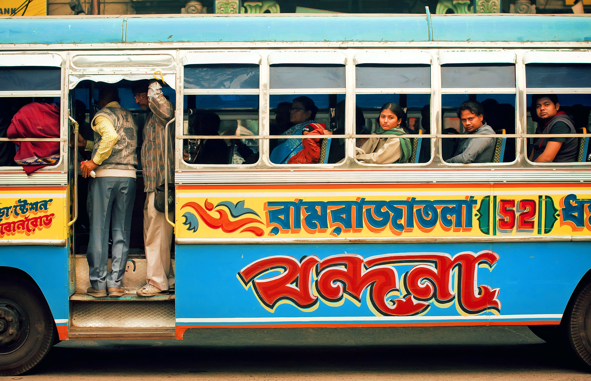 Sigma 50mm F1.4 EX DG HSM sample photo. People inside moving bus in india photography