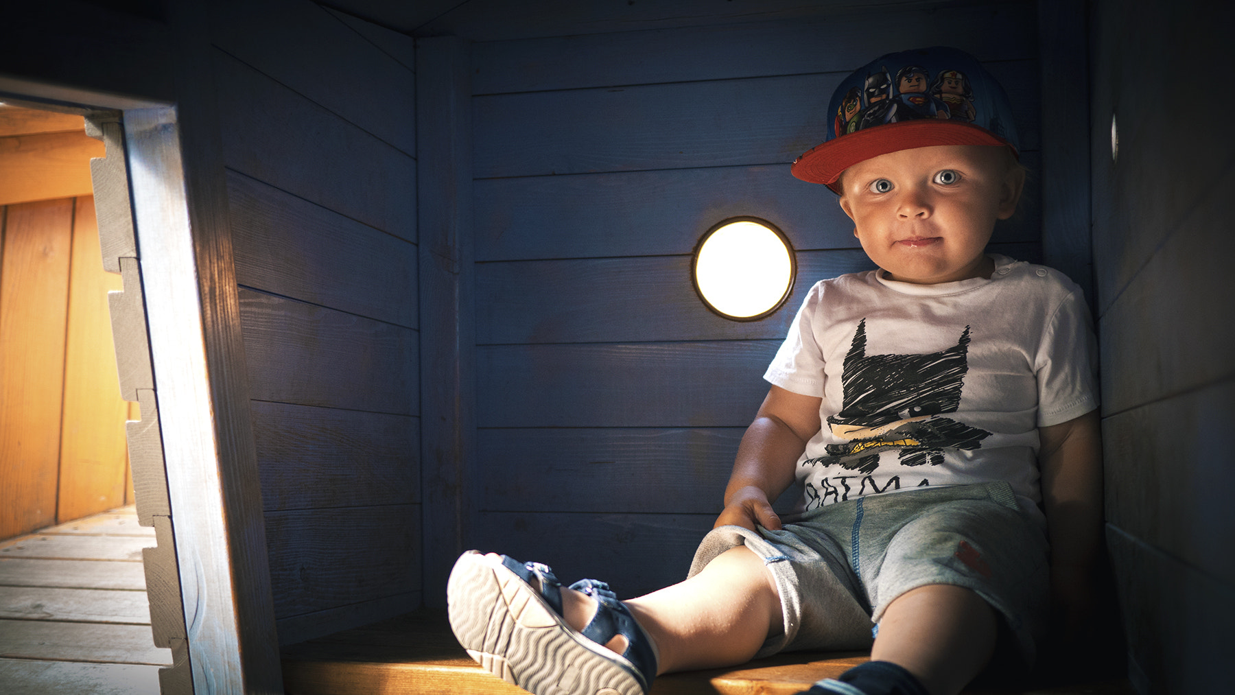 Panasonic Lumix DMC-GH4 + LUMIX G 20/F1.7 II sample photo. Young boy enjoying some downtime in the playground boat. photography