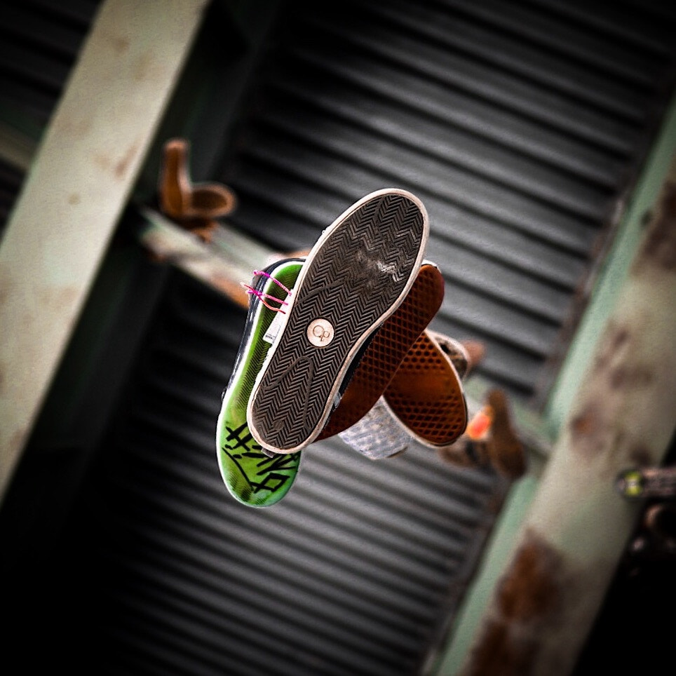 E 30mm F1.4 sample photo. Old skate shoes hanging from the fdr skatepark rafters philadelphia pa photography
