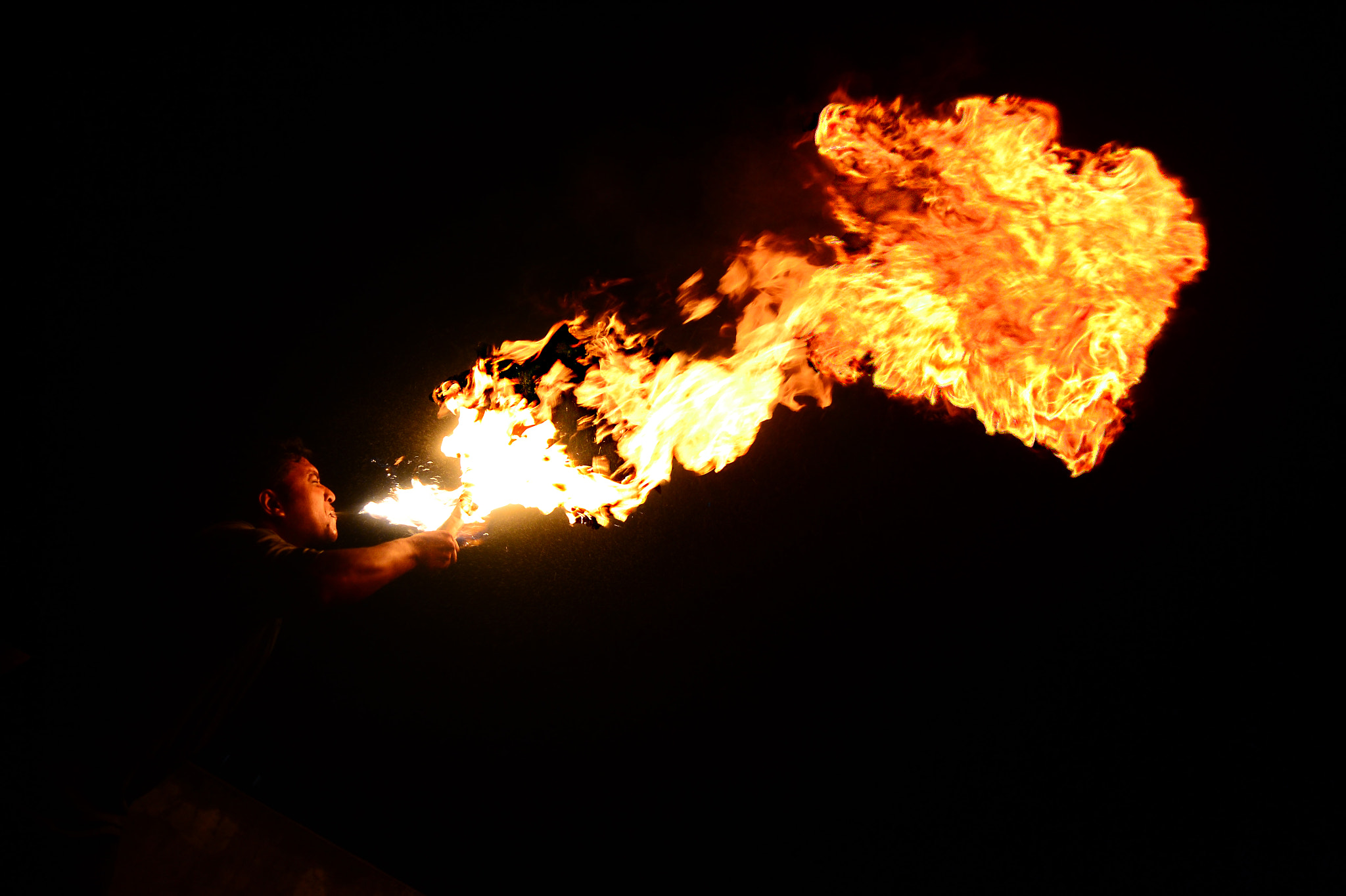 Nikon D3100 sample photo. Fire breathing photography