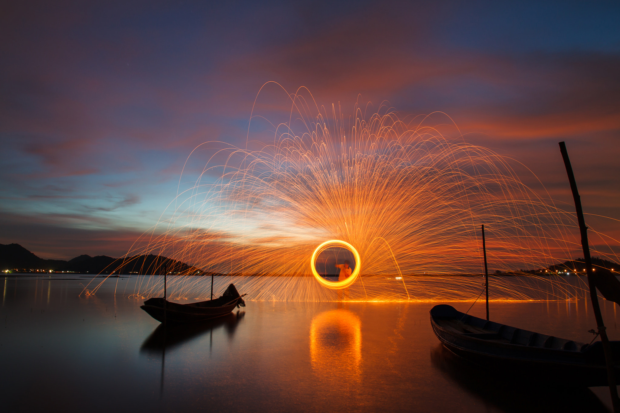 Canon EOS 500D (EOS Rebel T1i / EOS Kiss X3) sample photo. Beautiful steel wool with fishing boat in lake at sunset sky. photography
