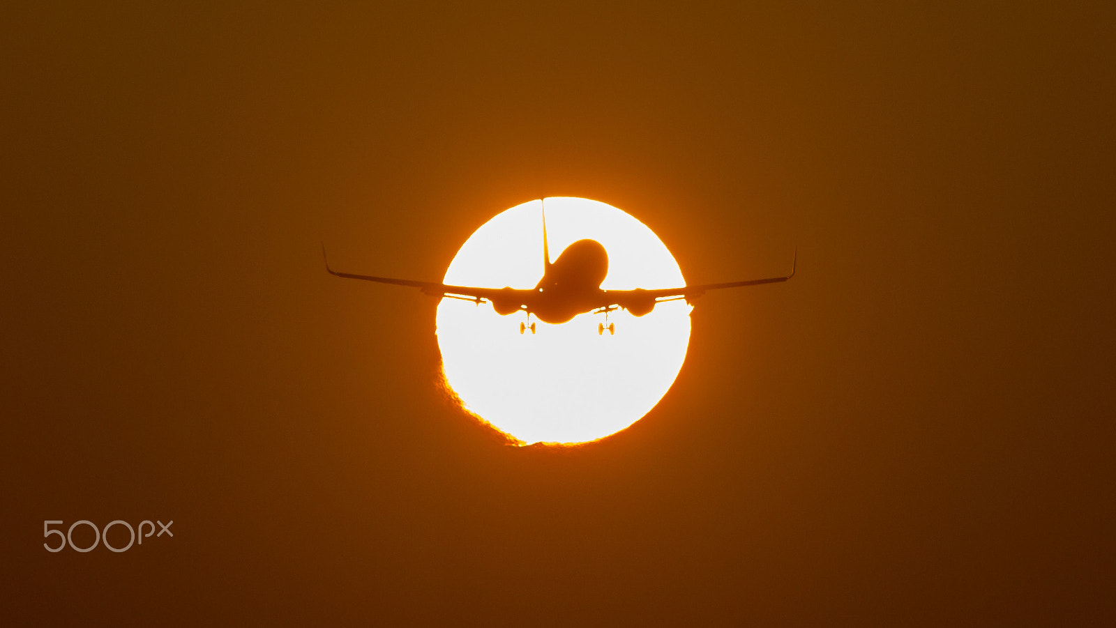 Canon EF 75-300mm f/4-5.6 USM sample photo. Suncross by an airplane photography