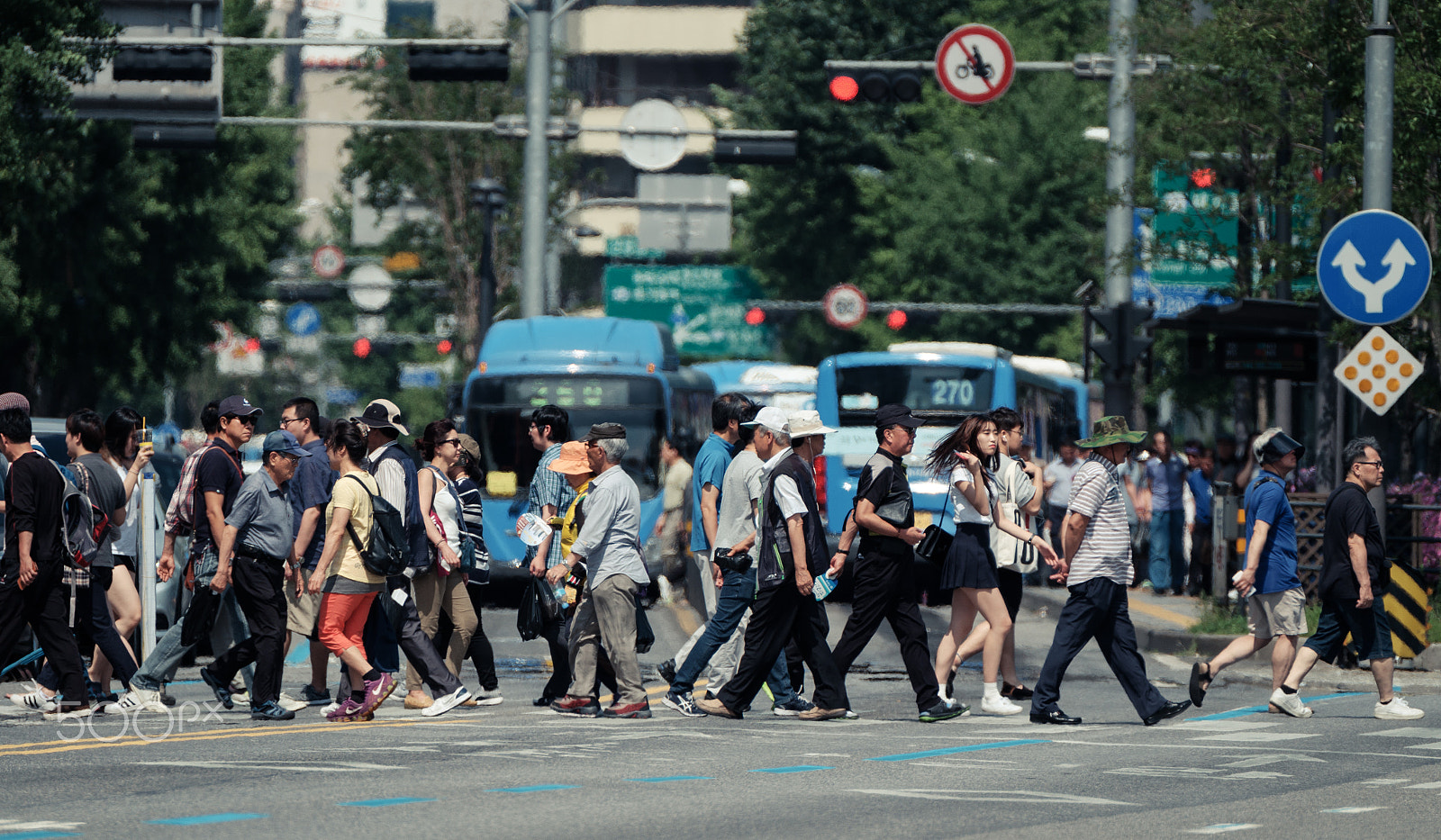 Fujifilm XF 100-400mm F4.5-5.6 R LM OIS WR sample photo. Cross the street photography