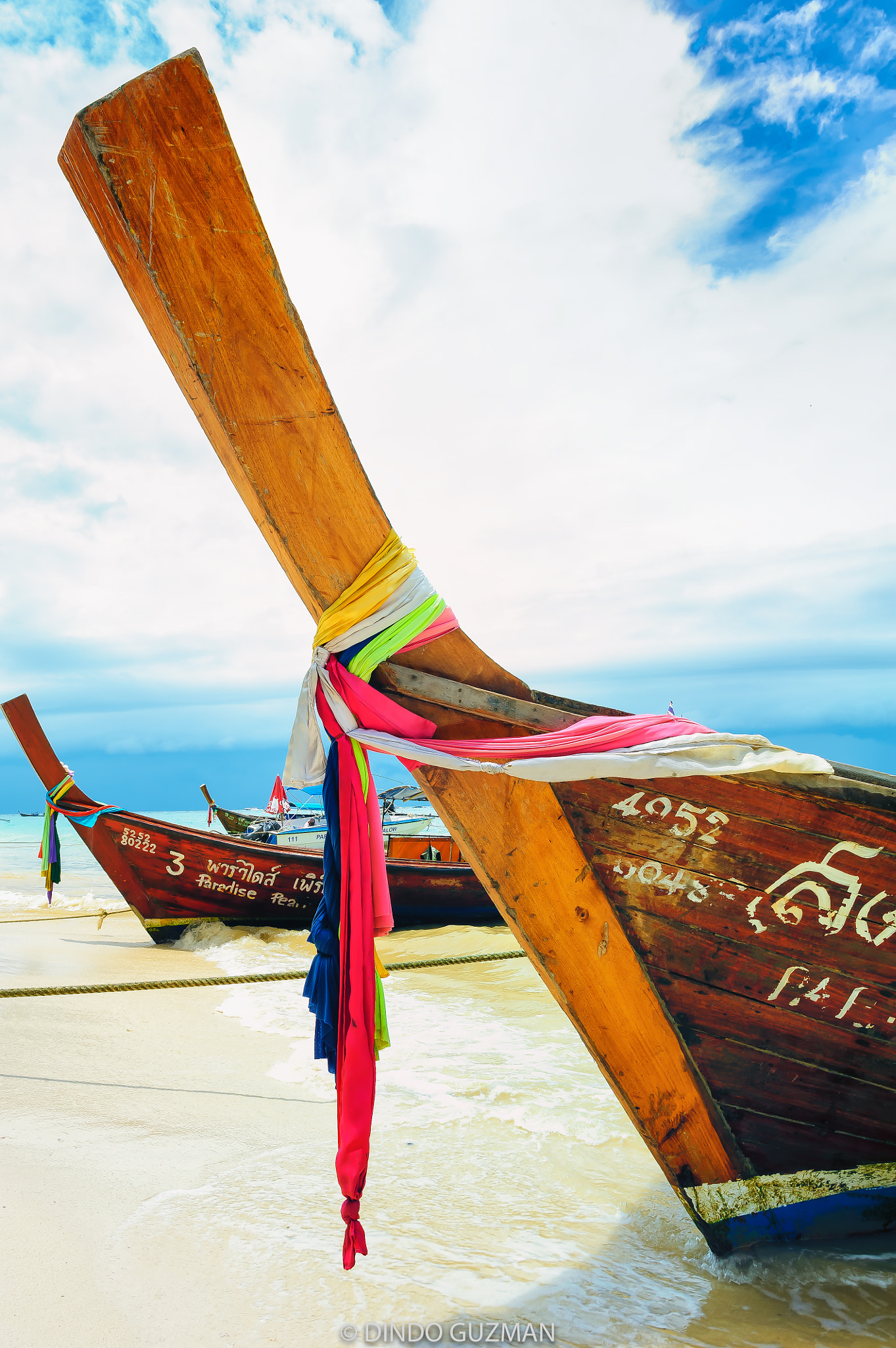Nikon D700 + Nikon AF-S Nikkor 24mm F1.4G ED sample photo. Traditional coloured sashes of respect tied to thai long boats for safe journeys and good luck. photography