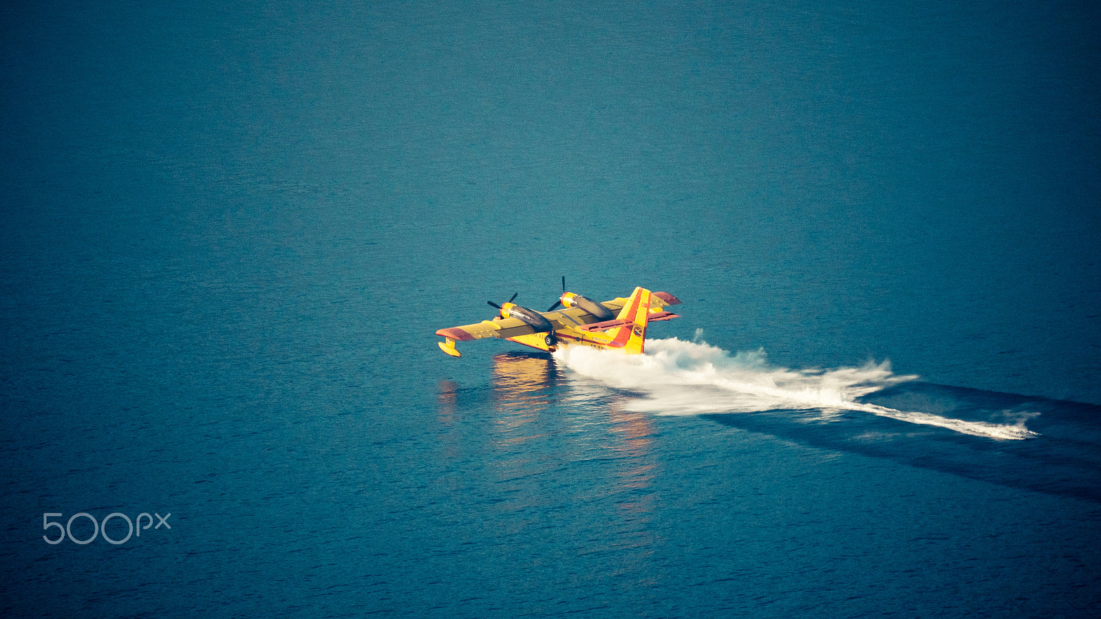 Panasonic Lumix DMC-GH4 sample photo. Aircraft firefighter take water in the sea photography