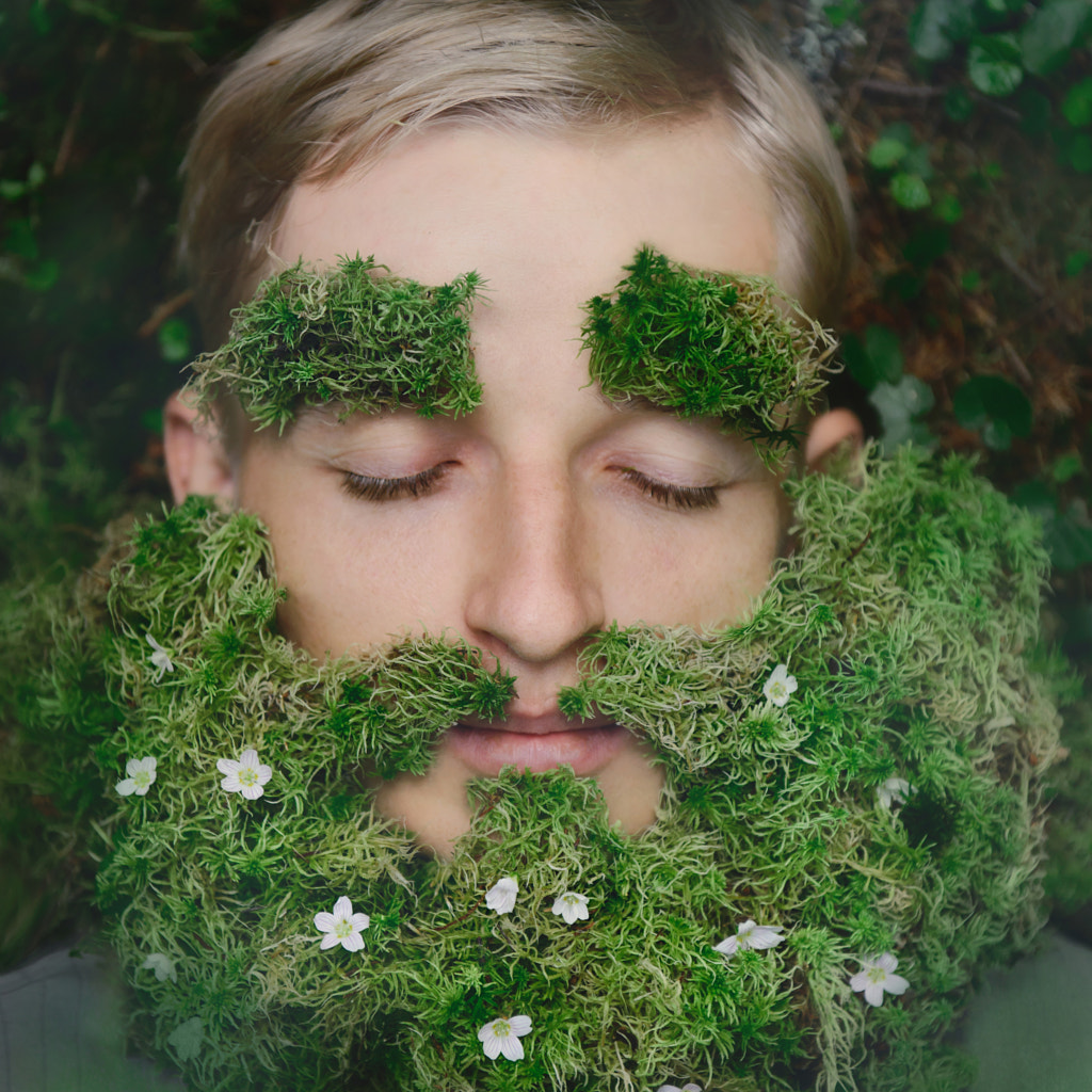 Sleeping hipster on grass with beard from moss by Nina Hilitukha on 500px.com