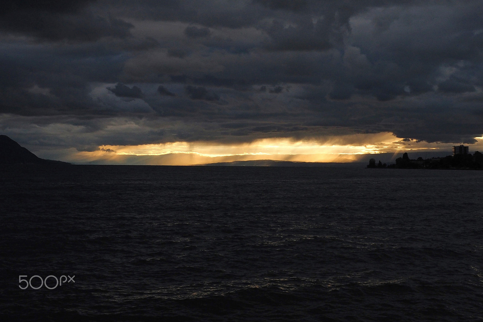 Olympus M.Zuiko Digital ED 12-40mm F2.8 Pro sample photo. Stormy sunset over geneva lake photography