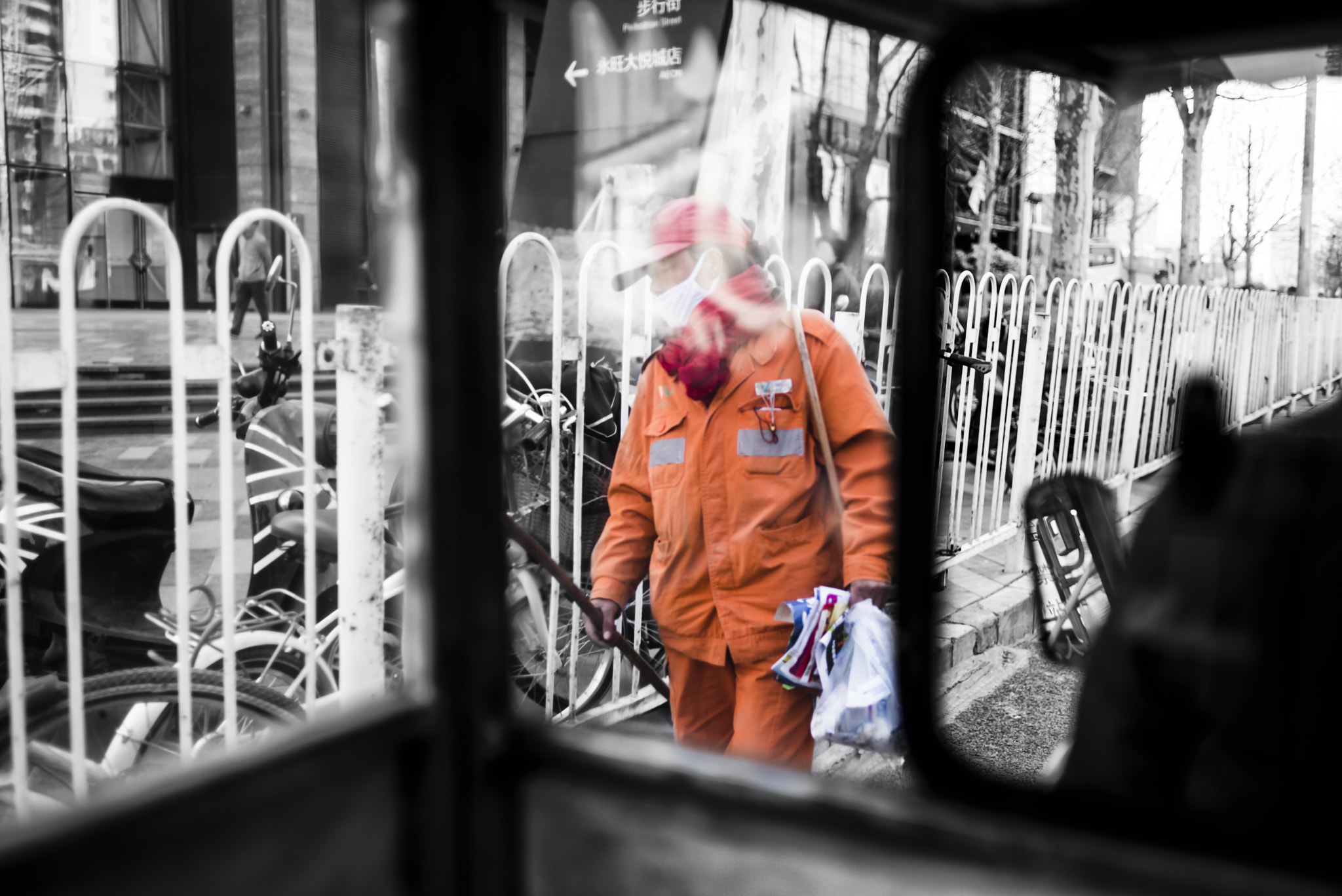 Nikon D810 + Nikon AF Nikkor 35mm F2D sample photo. Female sanitation worker in orange photography