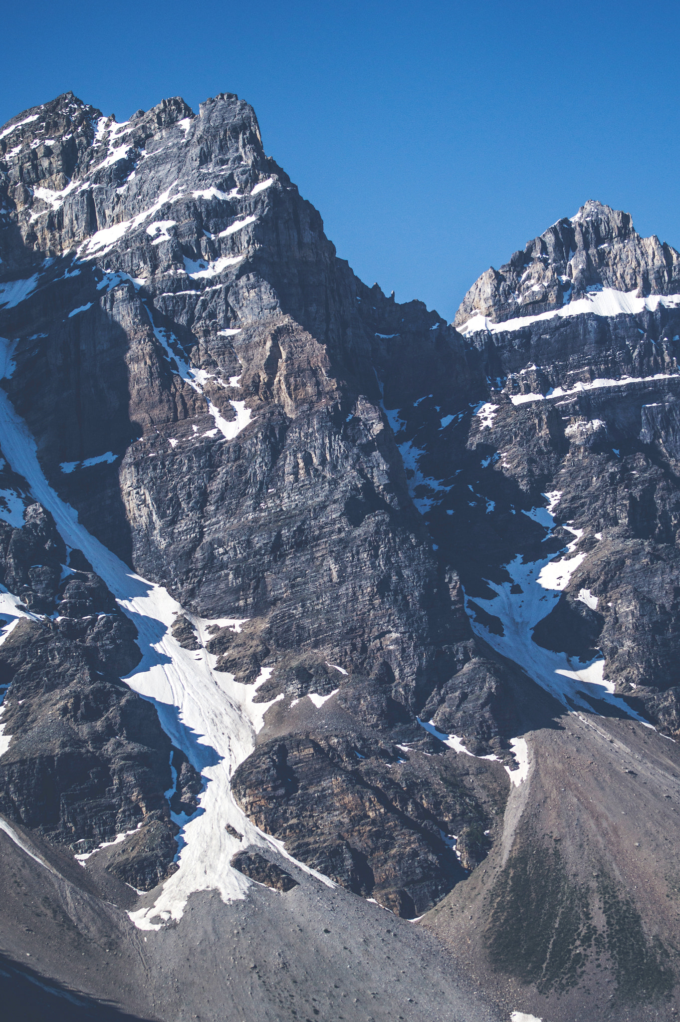 Sony 75-300mm F4.5-5.6 sample photo. Rough mountain with cliffs and snow photography