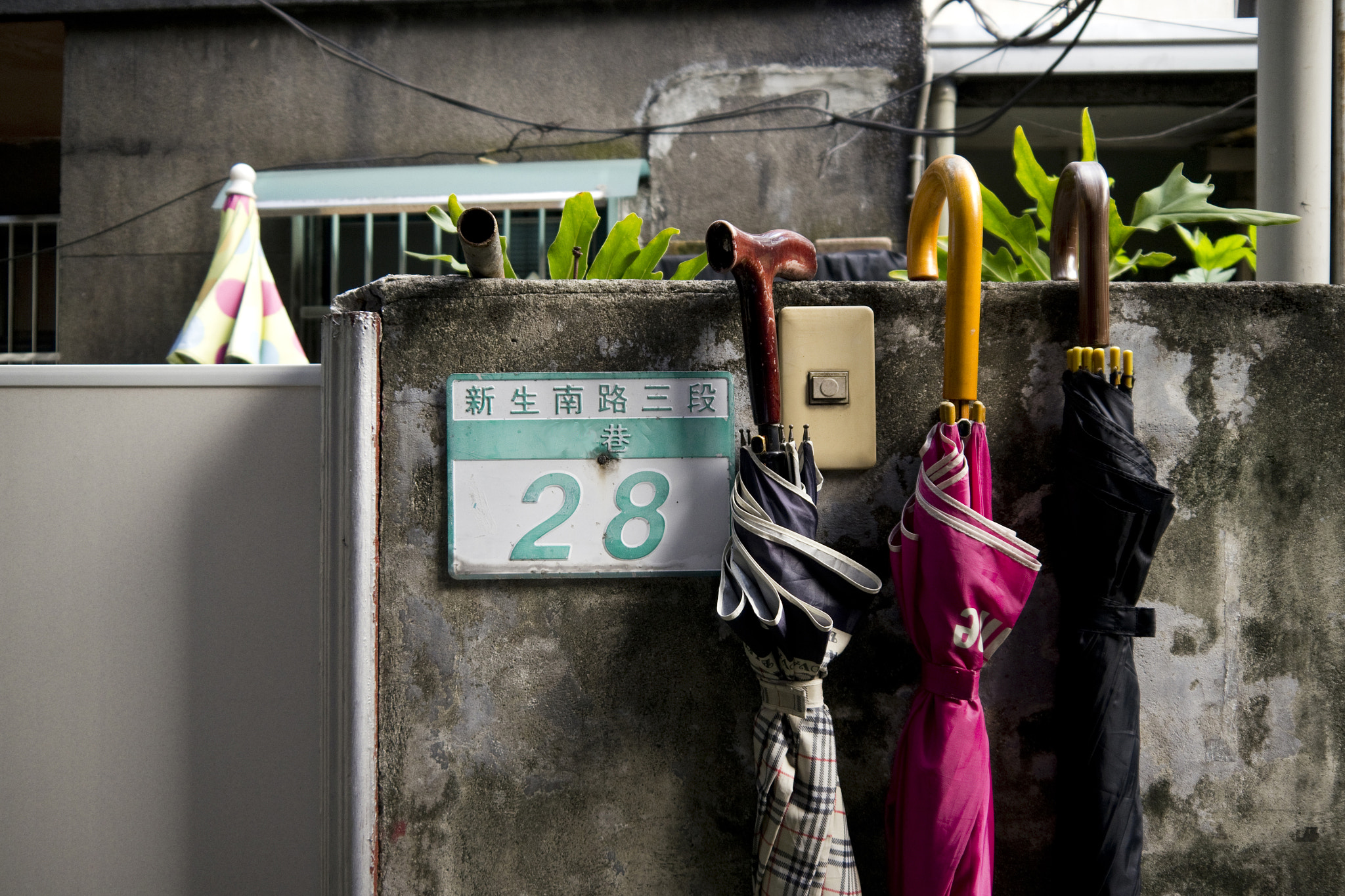 Panasonic Lumix DMC-GH2 sample photo. Umbrellas in an alleyway, taipei photography