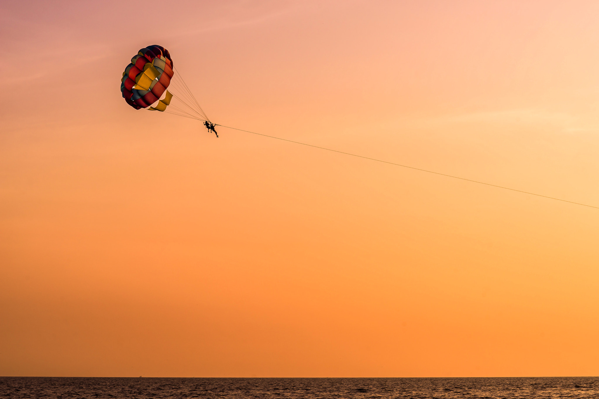 Sony a99 II + Tamron SP 70-300mm F4-5.6 Di USD sample photo. Parasailing during sunset photography