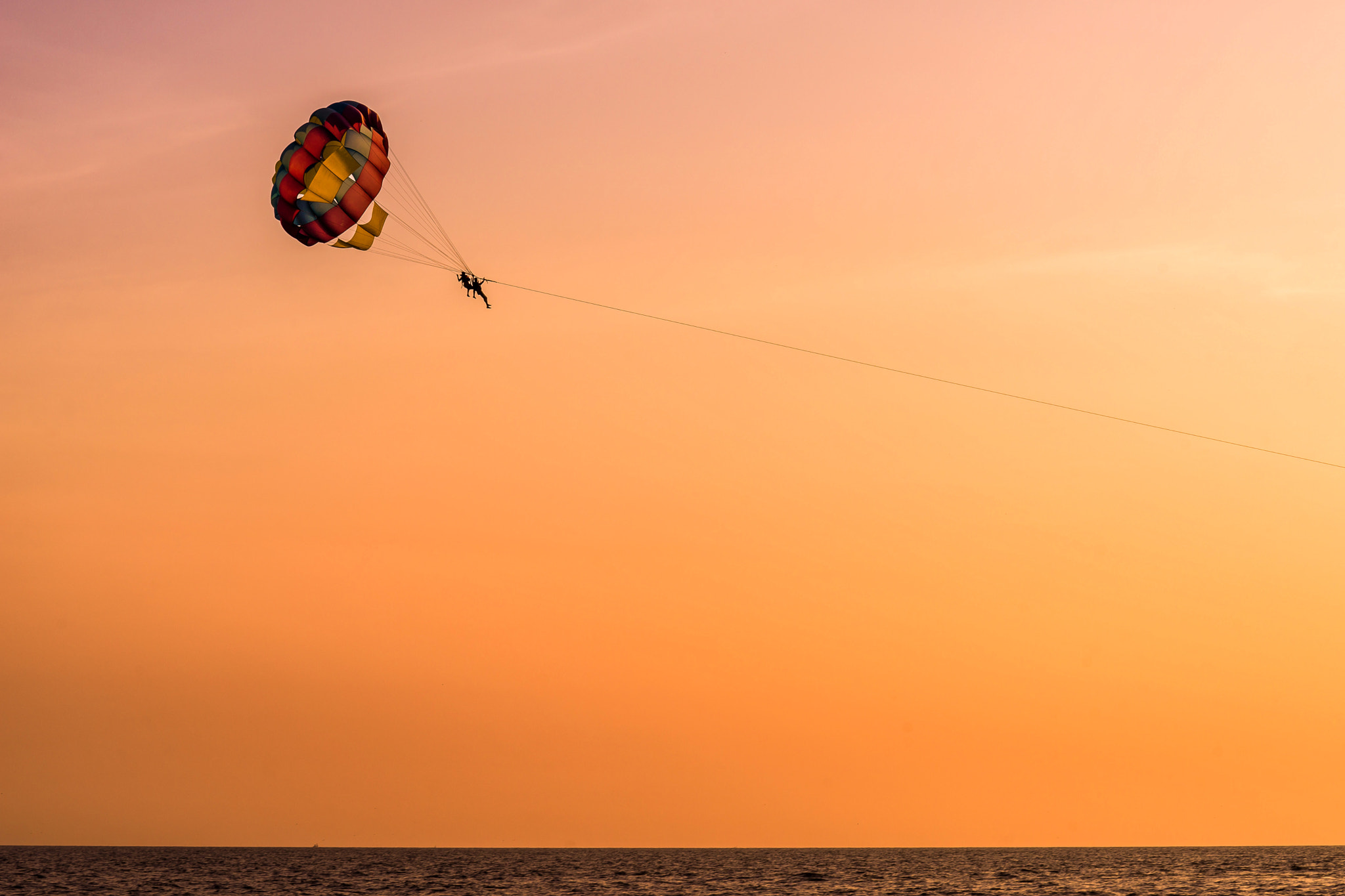 Tamron SP 70-300mm F4-5.6 Di USD sample photo. Parasailing during sunset photography