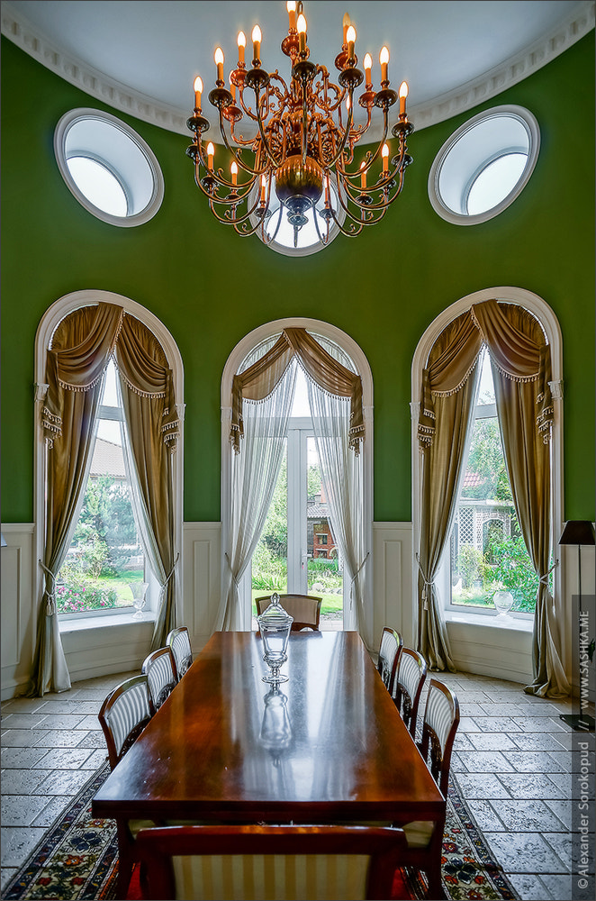 Beautiful living room interior with high windows