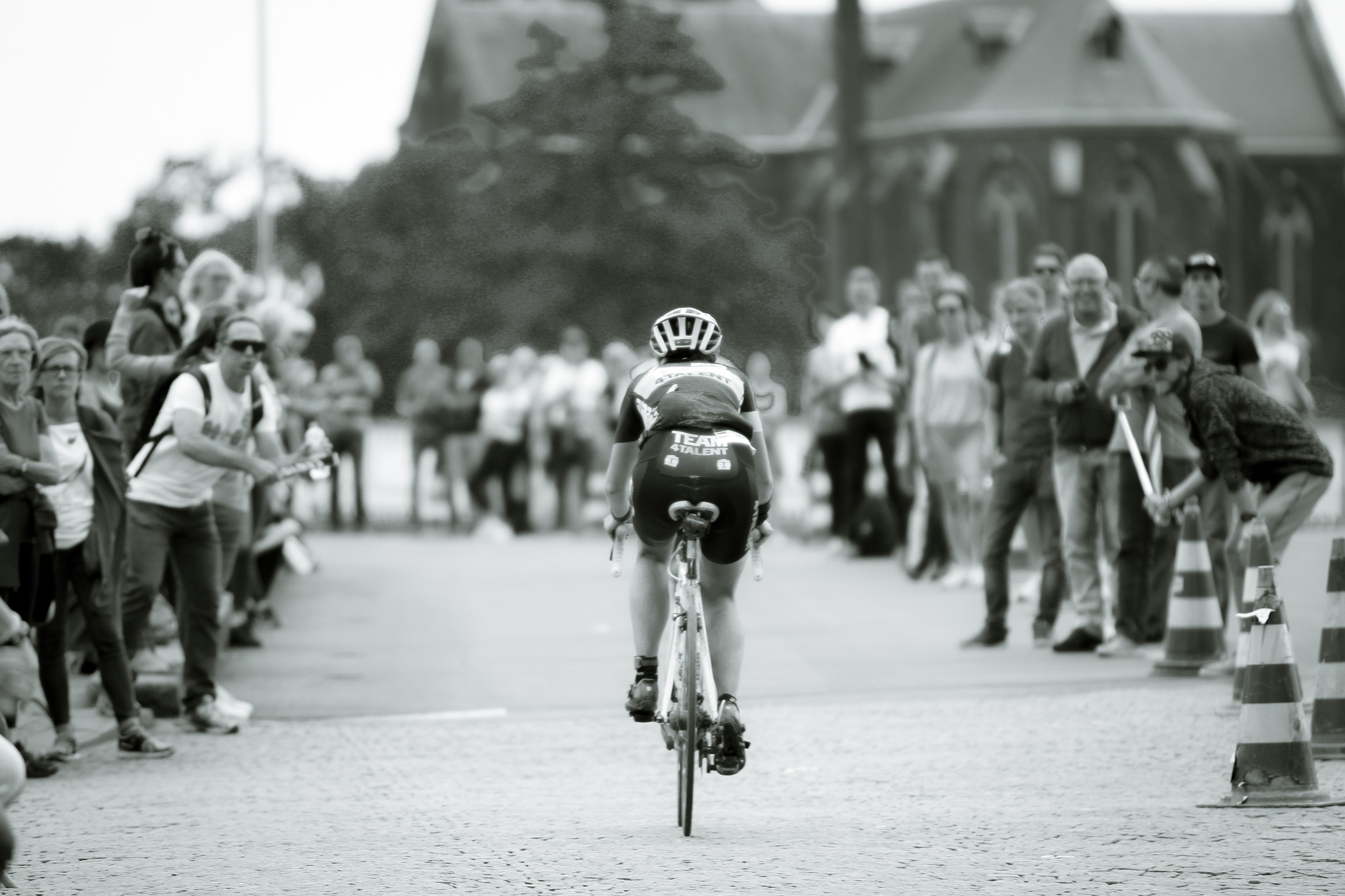 Canon EF 70-200mm F2.8L USM sample photo. Triathlete encouraged by her fans during an ironman photography