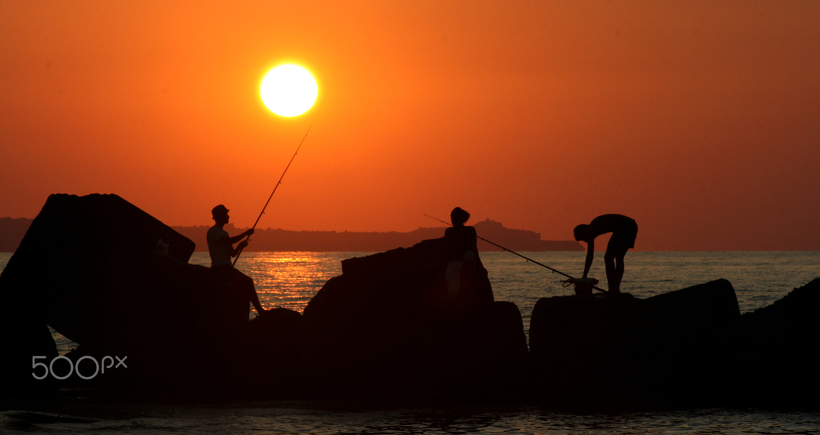 Canon EF 75-300mm f/4-5.6 USM sample photo. Fisherman at sunset photography