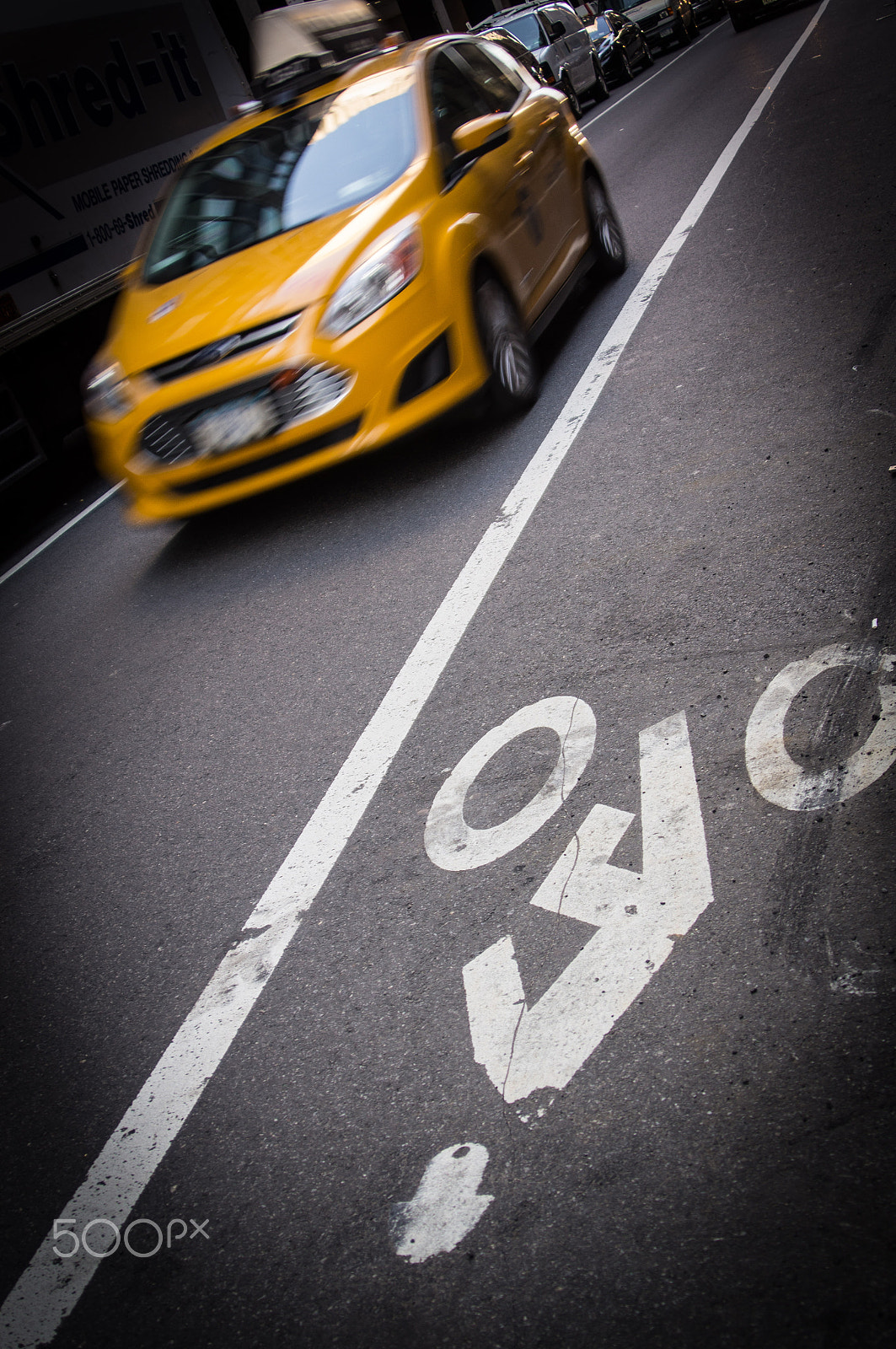 Sony SLT-A55 (SLT-A55V) sample photo. Yellow cab and bicycle lane photography