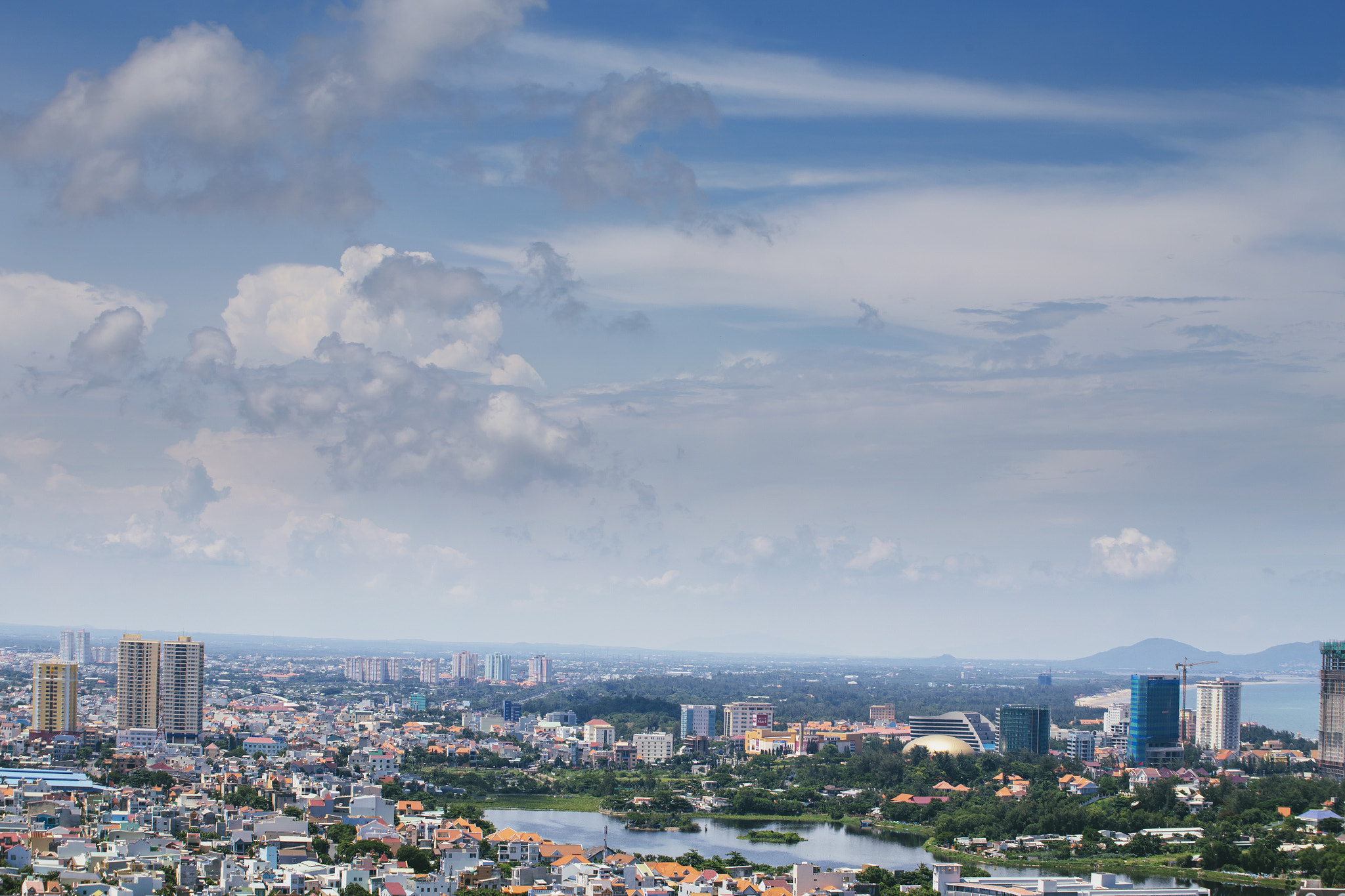 Canon EOS 6D + Canon EF 70-210mm f/4 sample photo. Flying clouds photography