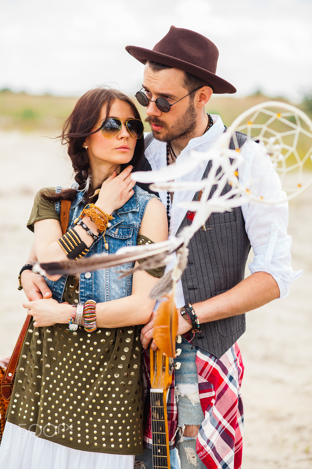 Canon EF 100mm F2.0 USM sample photo. Man and woman as boho hipsters against blue sky photography