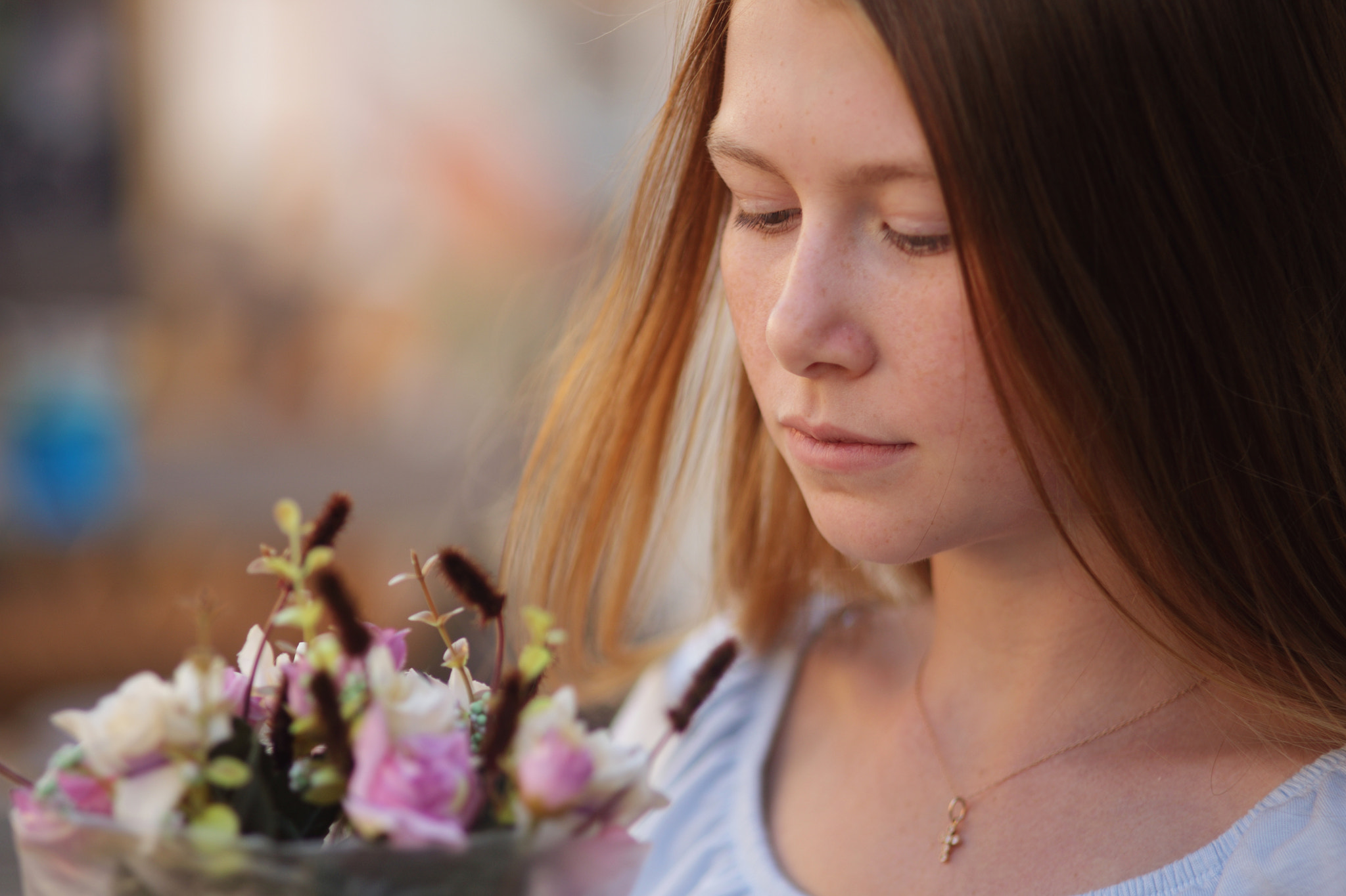 Canon EOS 6D + Canon EF 135mm F2.8 SF sample photo. Girl looking at bouquet of flowers photography