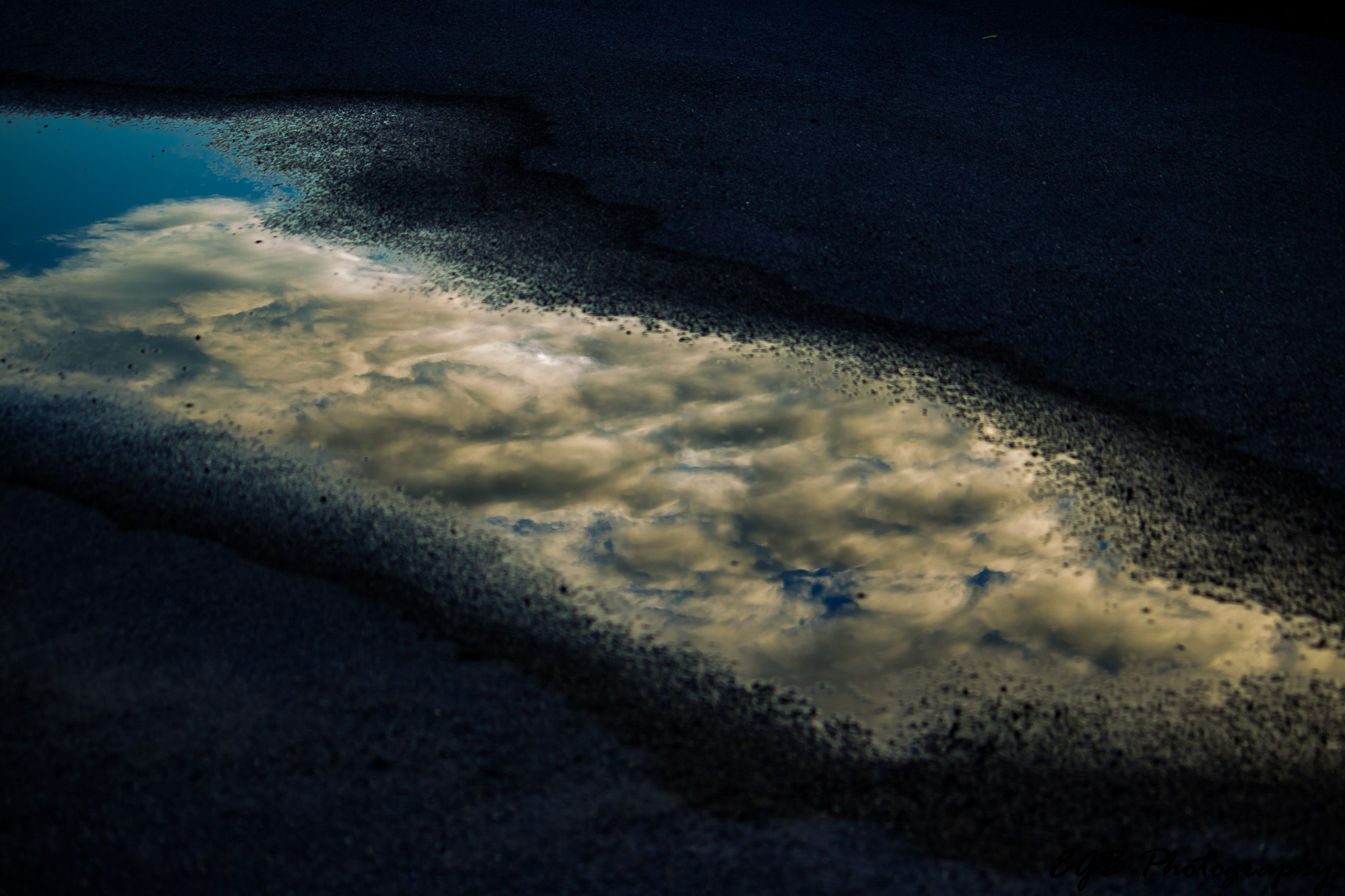 Canon EF-S 55-250mm F4-5.6 IS sample photo. Water puddle sky reflection photography