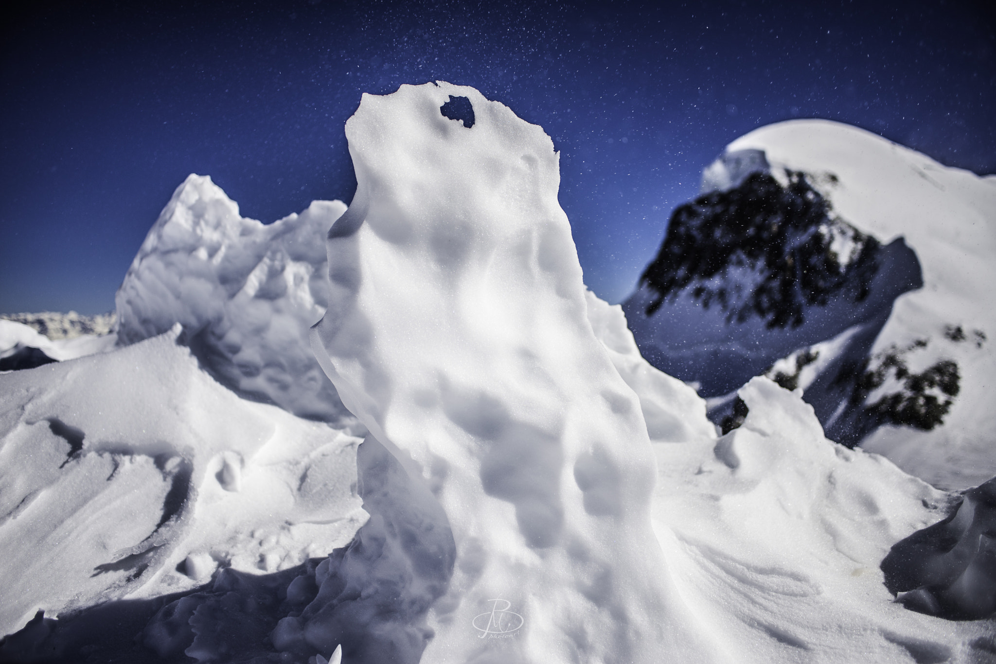 Nikon D610 + Nikon AF Nikkor 28mm F2.8D sample photo. Frozen ice form with breithorn in the background photography