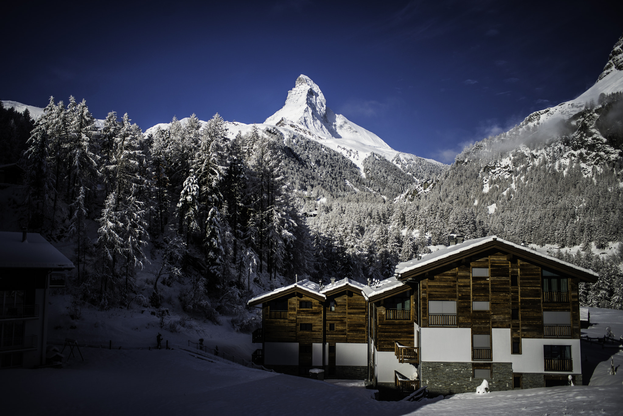Nikon D610 + Nikon AF Nikkor 28mm F2.8D sample photo. Zermatt chalets with matterhorn view photography