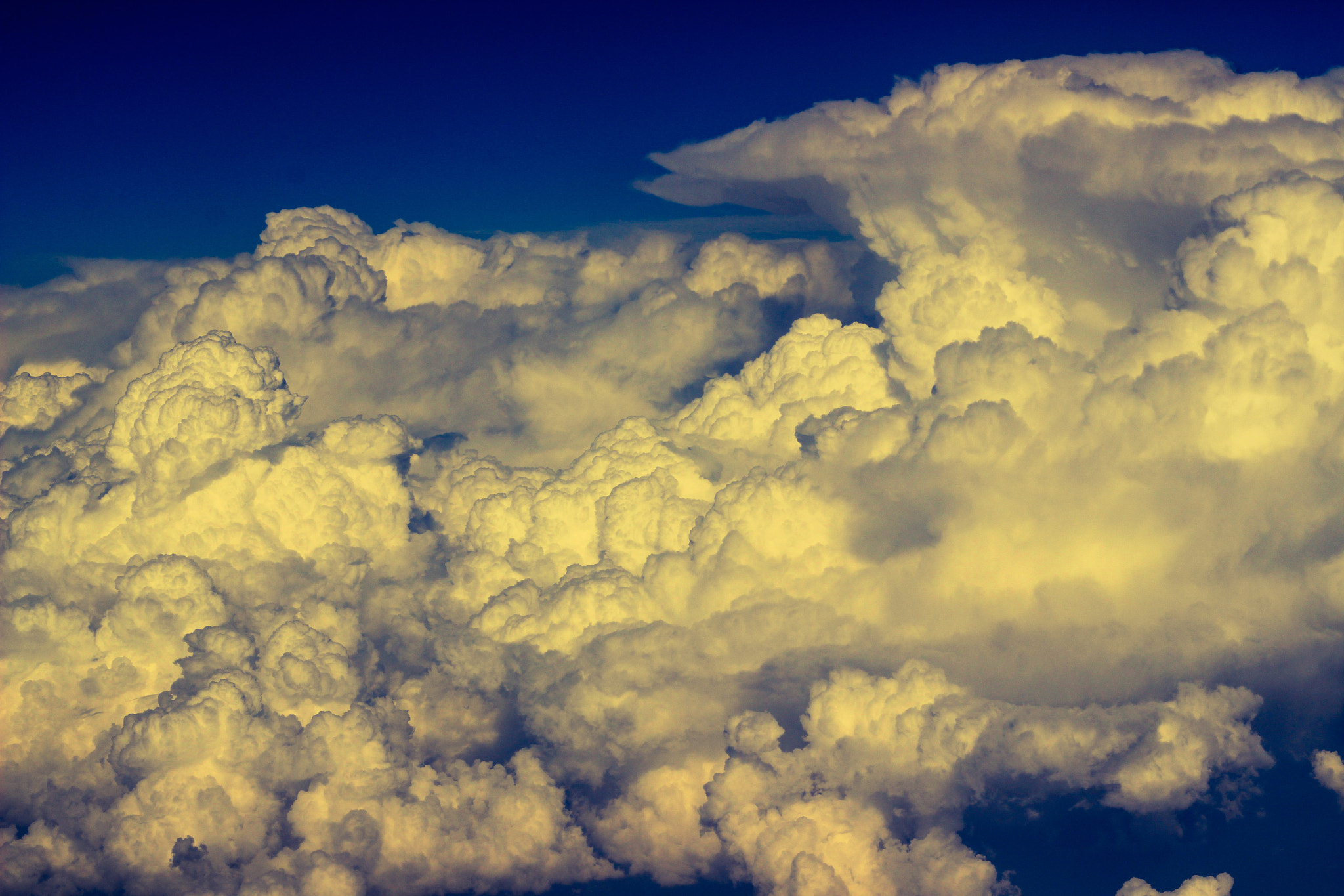 Canon EOS 600D (Rebel EOS T3i / EOS Kiss X5) + Canon EF 50mm F1.8 II sample photo. Shot from 24000ft the mighty sun illuminating the best of cumulonimbus clouds.... photography