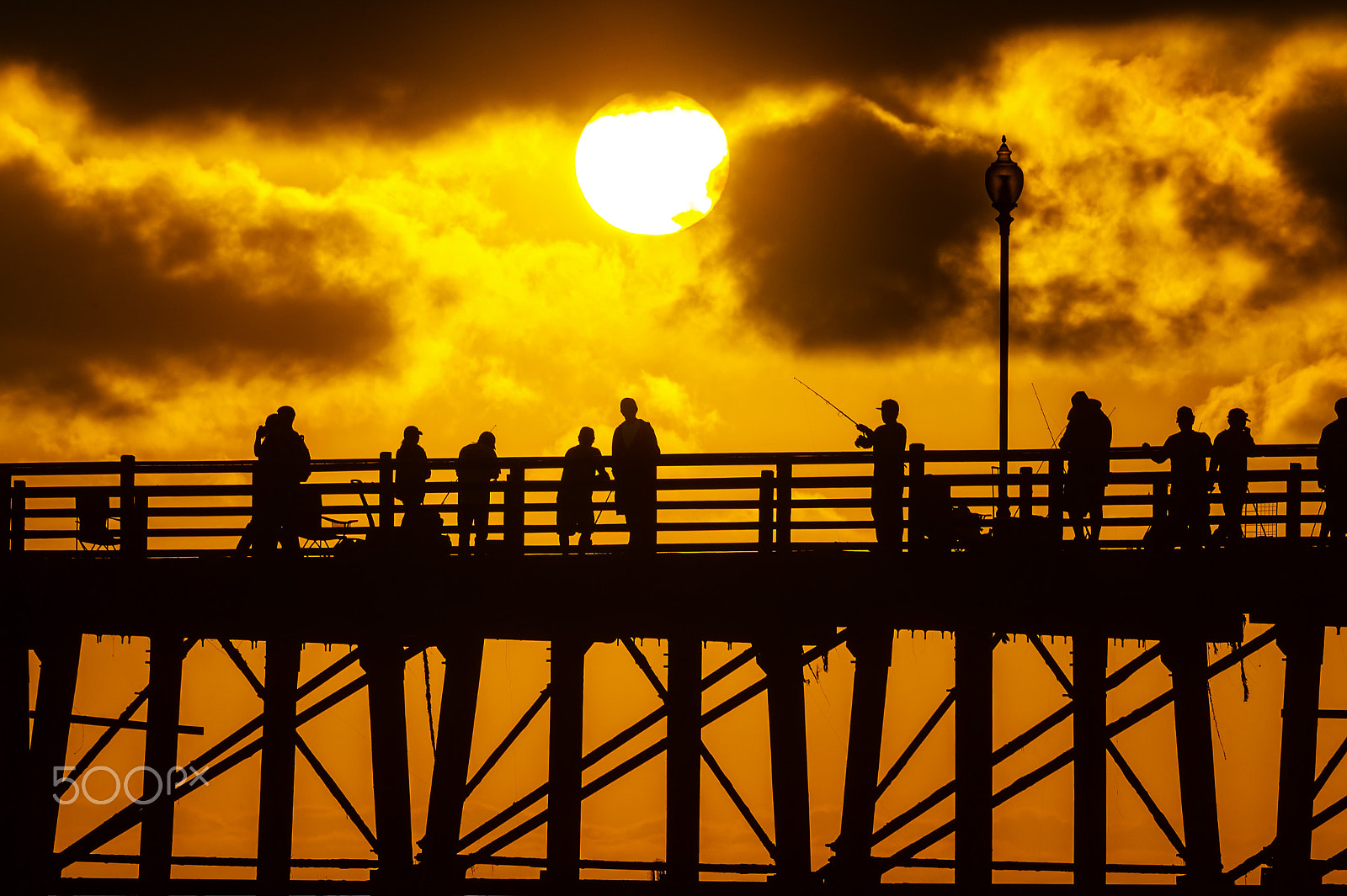 Nikon D3S sample photo. Fishermen on the oceanside pier at sunset photography