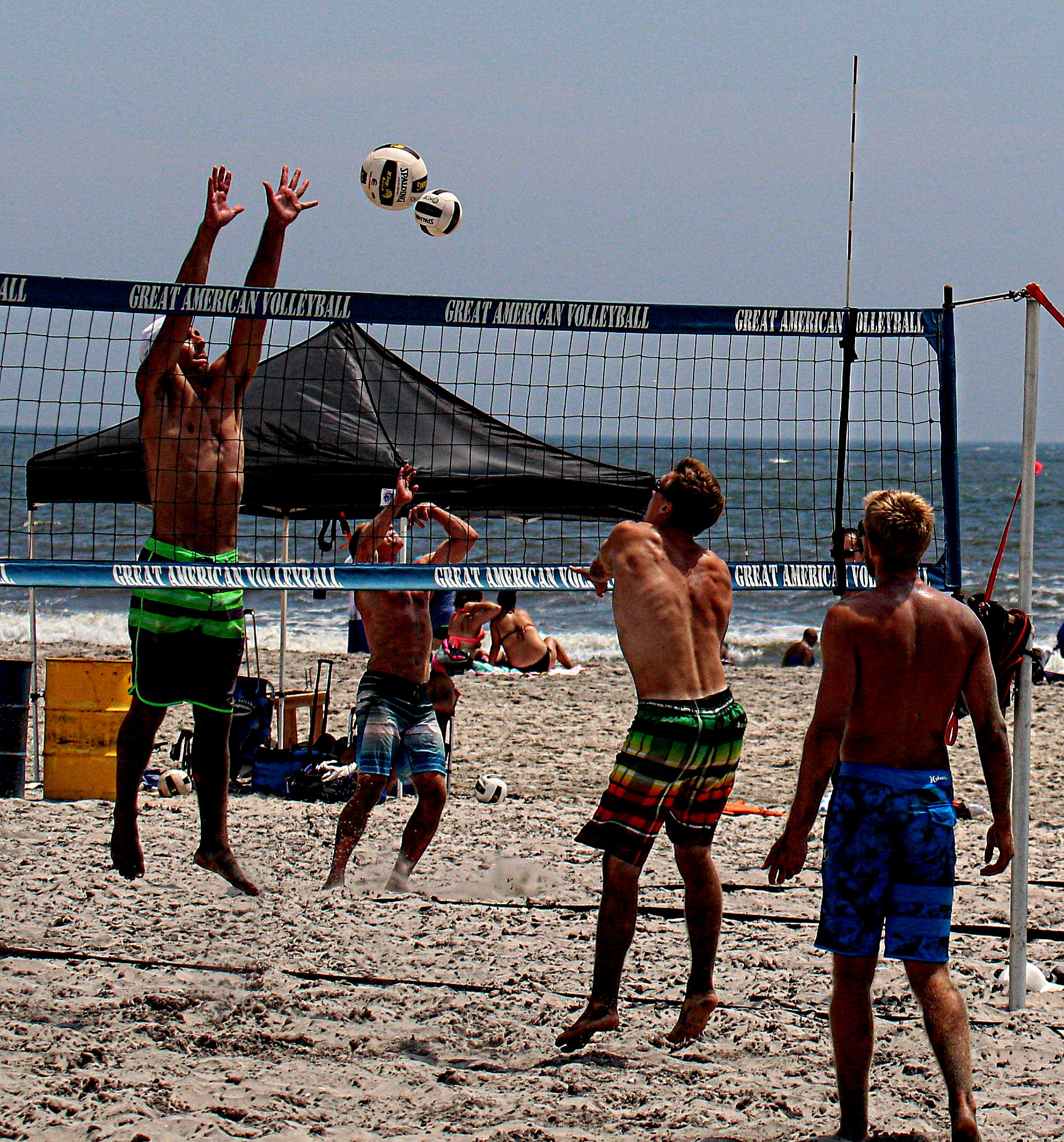 Canon EF 70-300mm F4-5.6L IS USM sample photo. Two side by side volleyball games photography