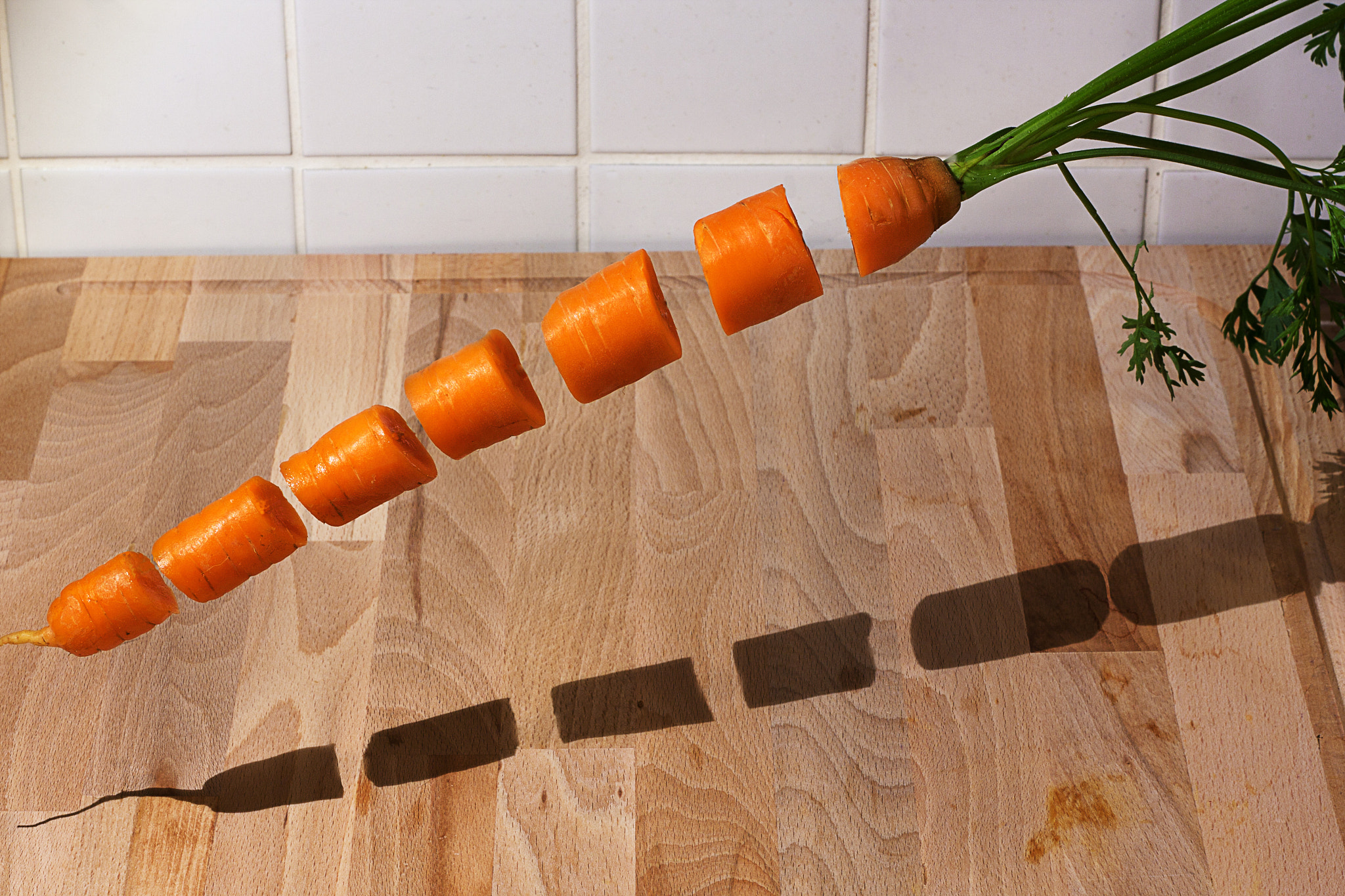 Canon EOS 40D + Canon EF 50mm f/1.8 sample photo. Levitating carrot photography