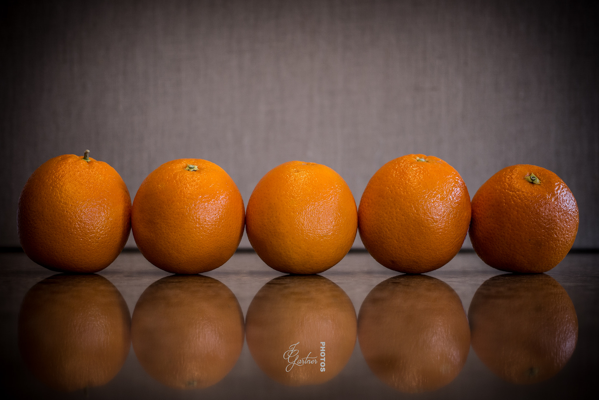 Canon EF 40mm F2.8 STM sample photo. Row of oranges photography