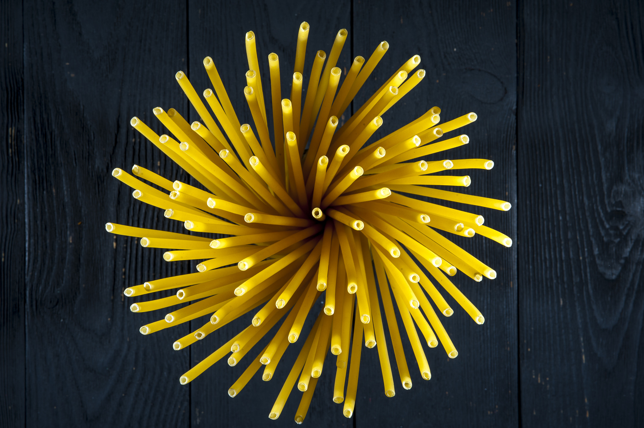 Nikon D700 + AF Micro-Nikkor 105mm f/2.8 sample photo. Bundle of raw pasta on wooden background. photography