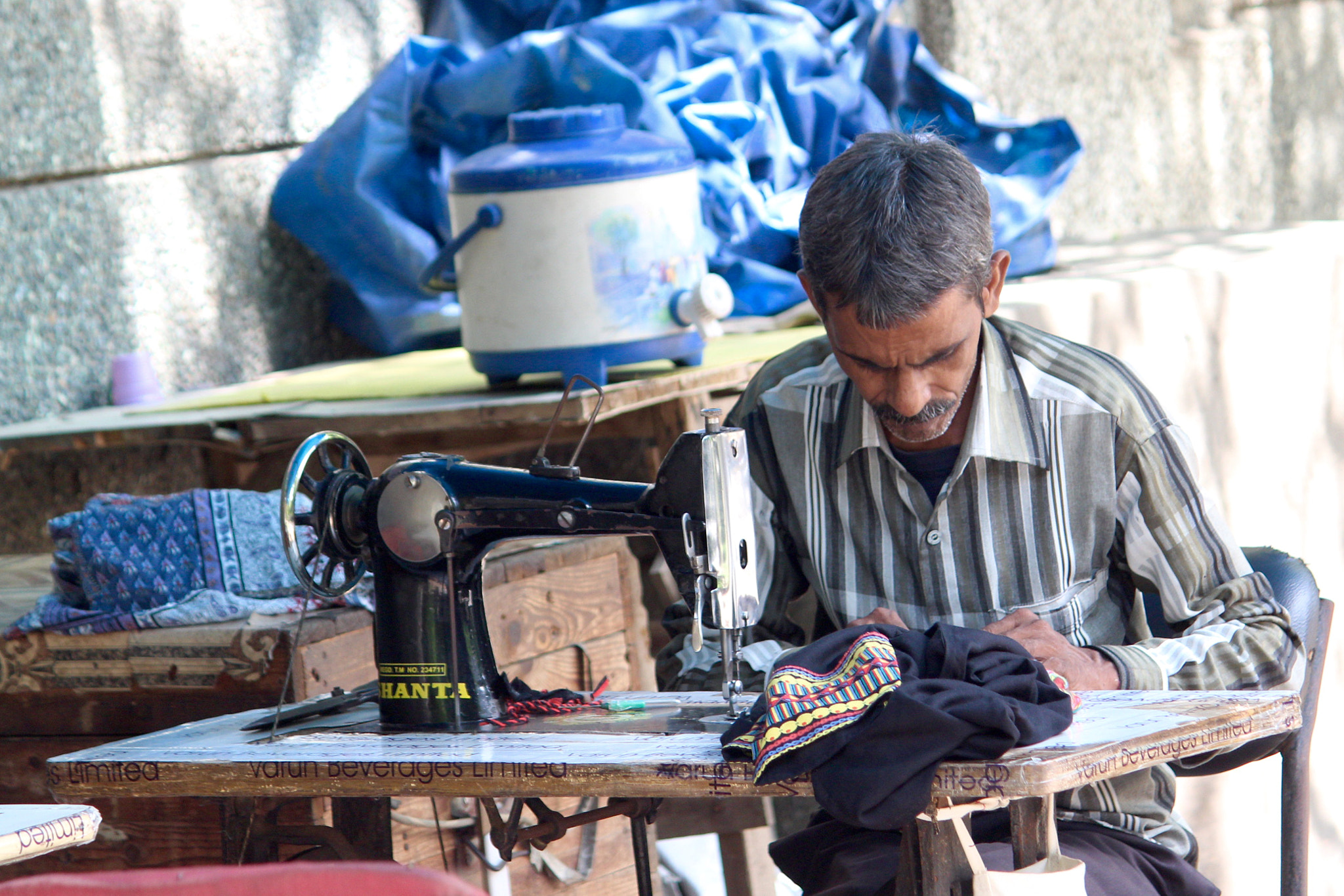 Canon EF-S 55-250mm F4-5.6 IS II sample photo. A tailor in the neighbourhood photography