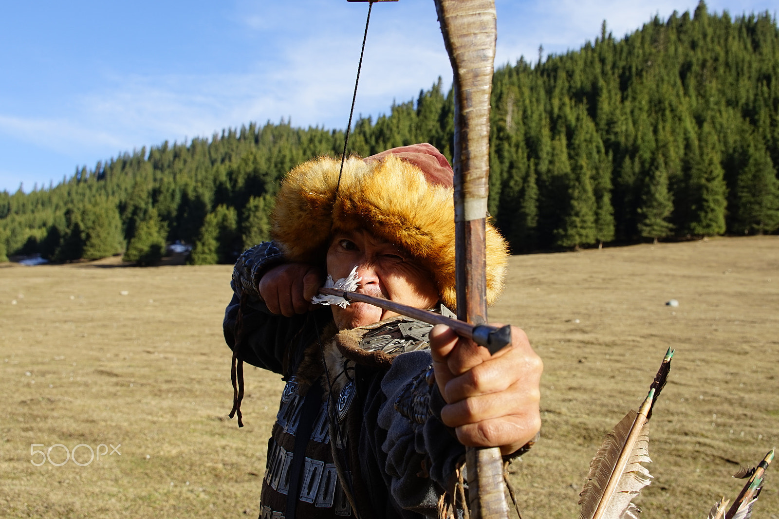 Sony E 18-55mm F3.5-5.6 OSS sample photo. Nomad in traditional clothes with bow and arrow photography