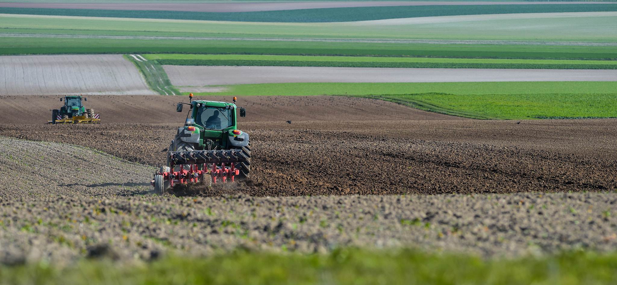 Nikon AF-S Nikkor 300mm F2.8G ED VR II sample photo. Tractor plowing the fields photography