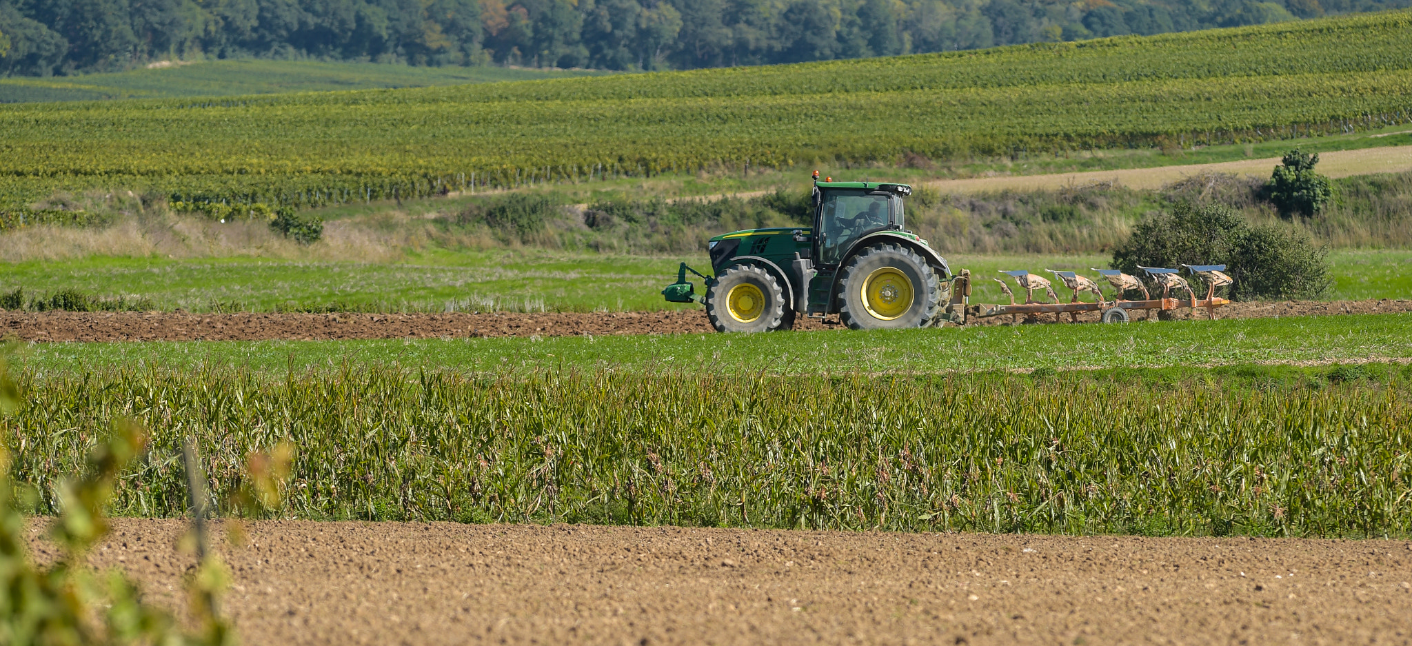 Nikon AF-S Nikkor 300mm F2.8G ED VR II sample photo. Tractor plowing the fields photography