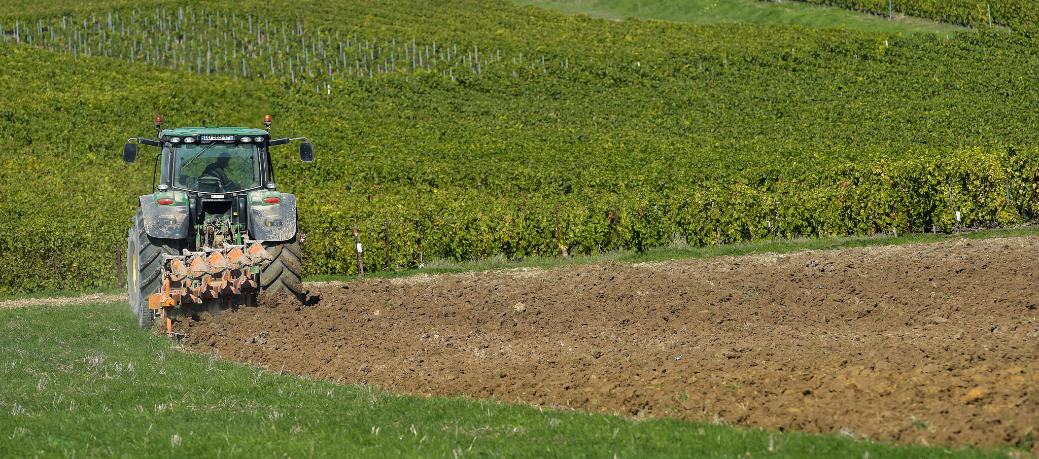 Nikon AF-S Nikkor 300mm F2.8G ED VR II sample photo. Tractor plowing the fields photography