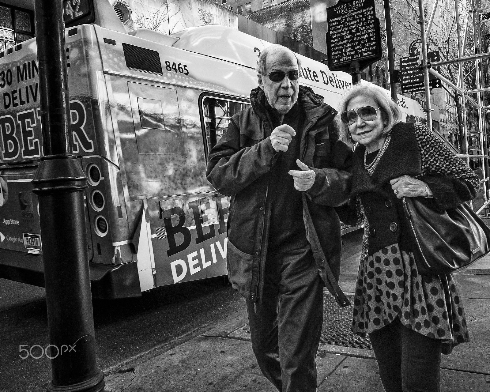 Panasonic Lumix DMC-GX7 + Panasonic Lumix G 14mm F2.5 ASPH sample photo. Couple in the wind on broad street, 2016 photography