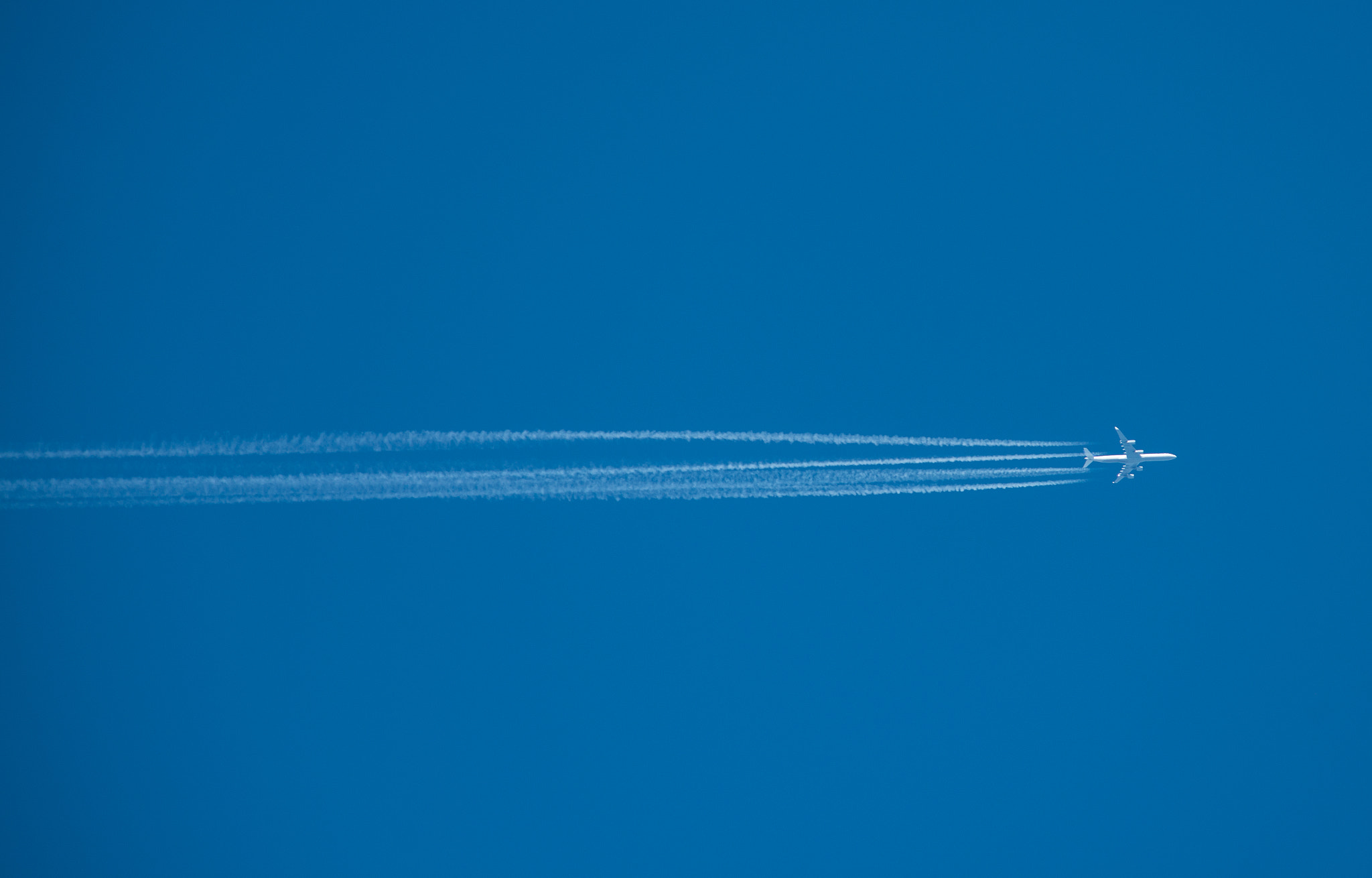 Nikon D800E + Nikon AF-S Nikkor 300mm F2.8G ED VR II sample photo. Shot of a jet plane high in the blue sky photography