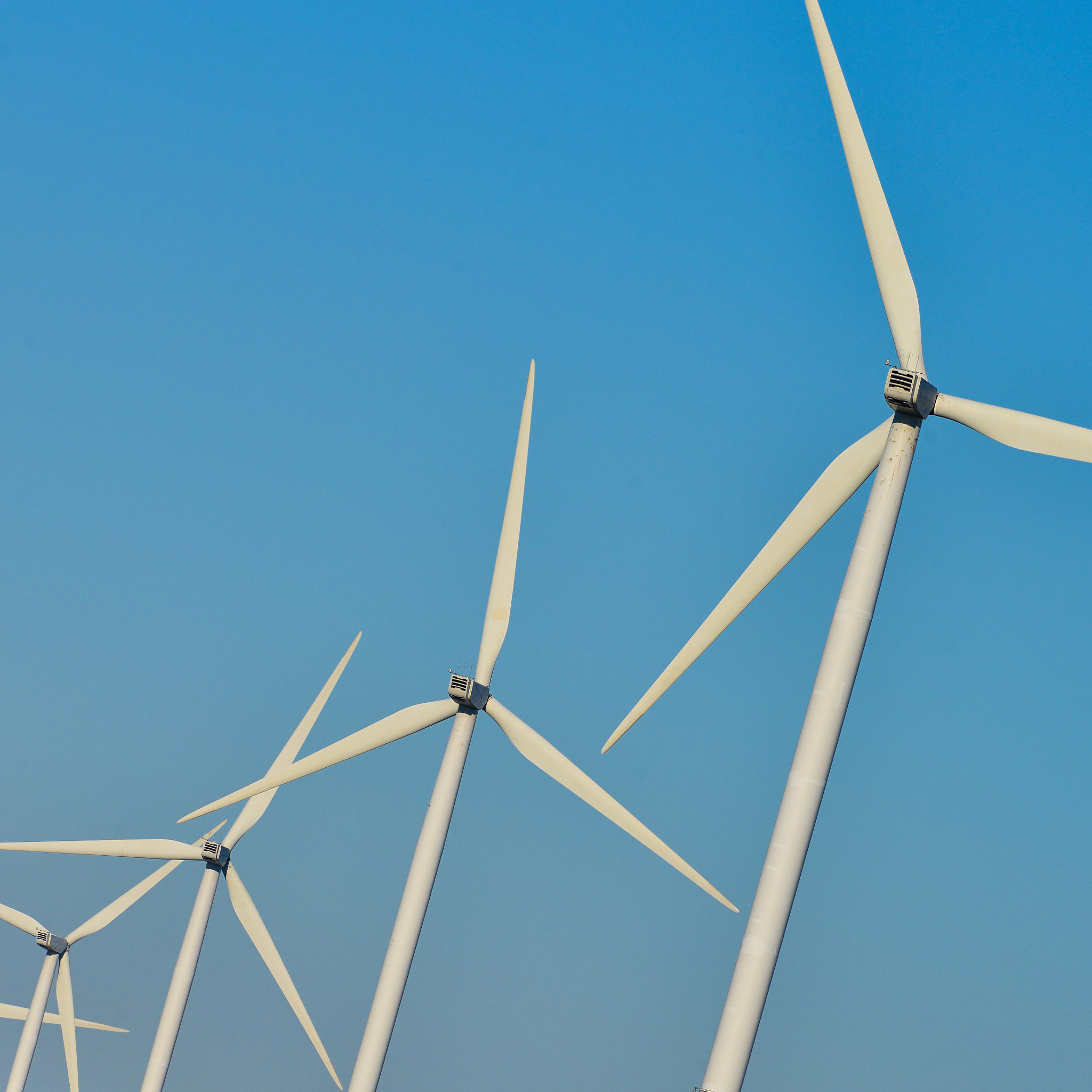 Nikon AF-S Nikkor 300mm F2.8G ED VR II sample photo. Windmills for electric power production on blue sky photography