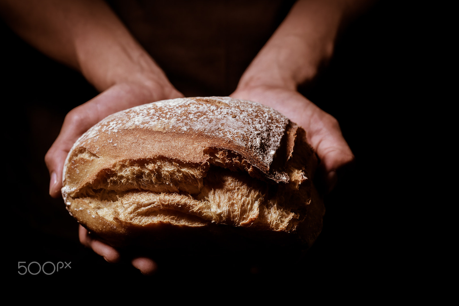 Nikon D4S + Nikon AF-S Nikkor 85mm F1.4G sample photo. Baker man holding a round bread photography