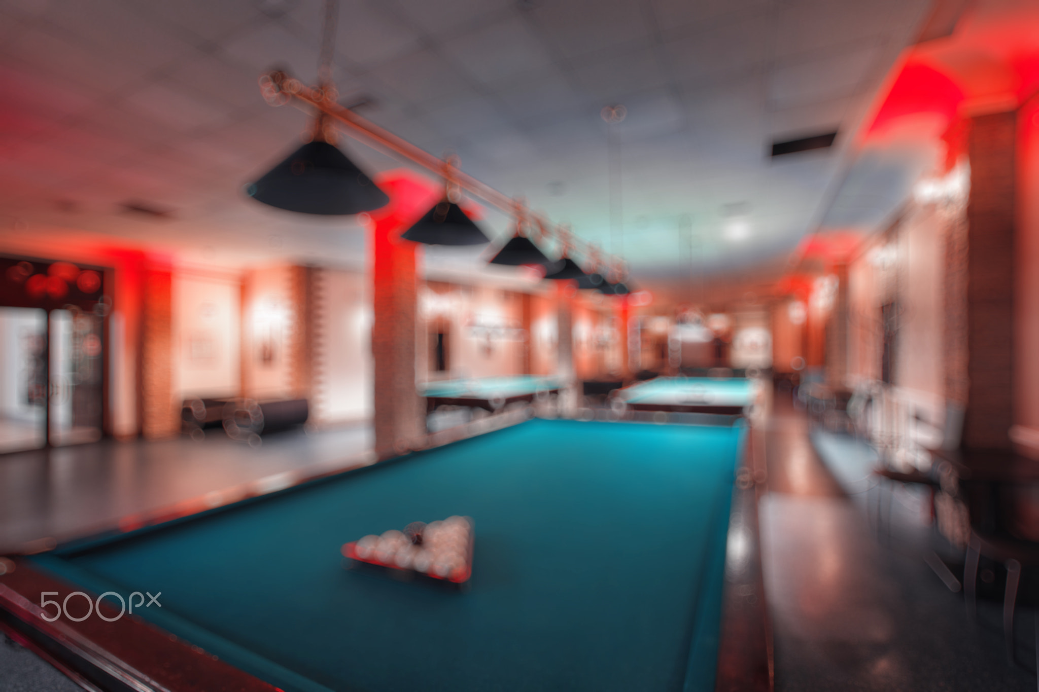 abstract blur. brand new and modern billiard interior in night time