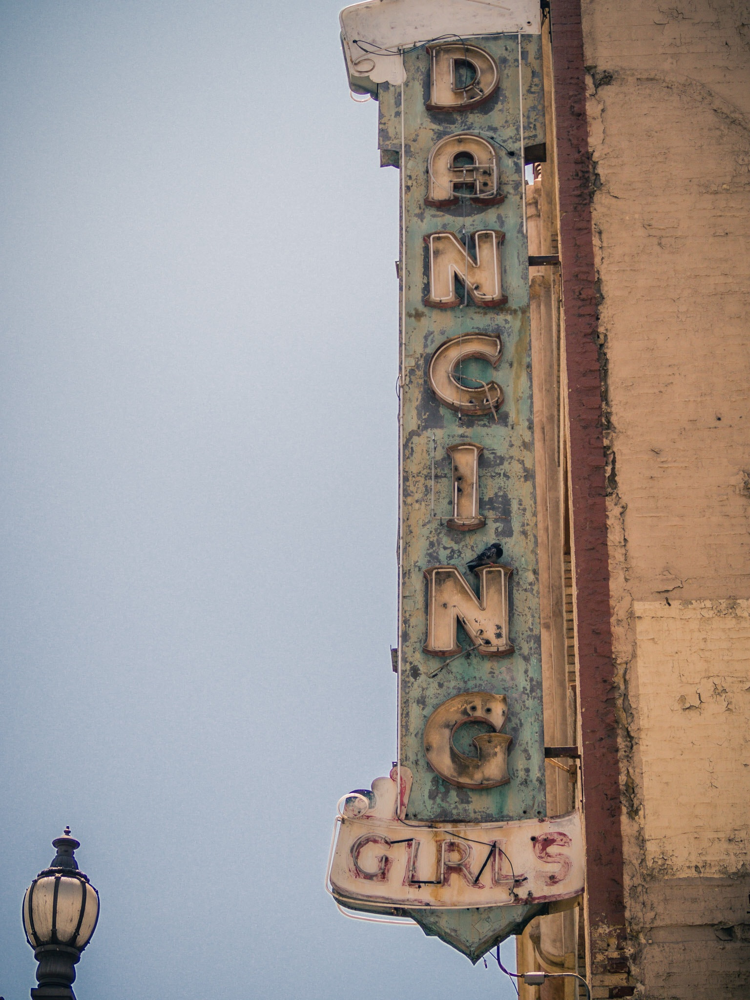 Olympus PEN-F sample photo. Dancing girls sign in downtown los angeles photography