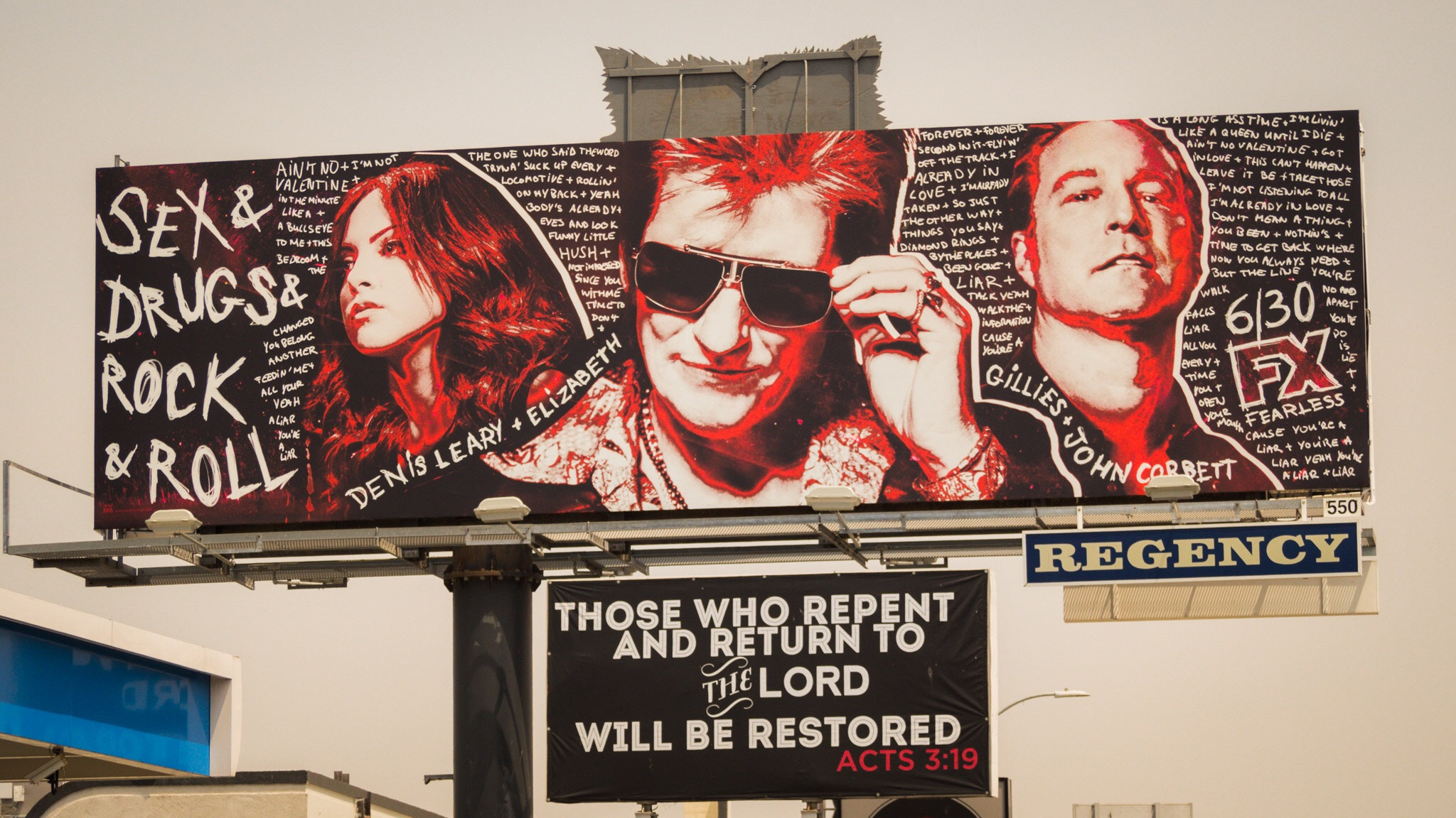 Olympus PEN-F sample photo. Billboard with unfortunate rear cat head alignment, plus repent! photography