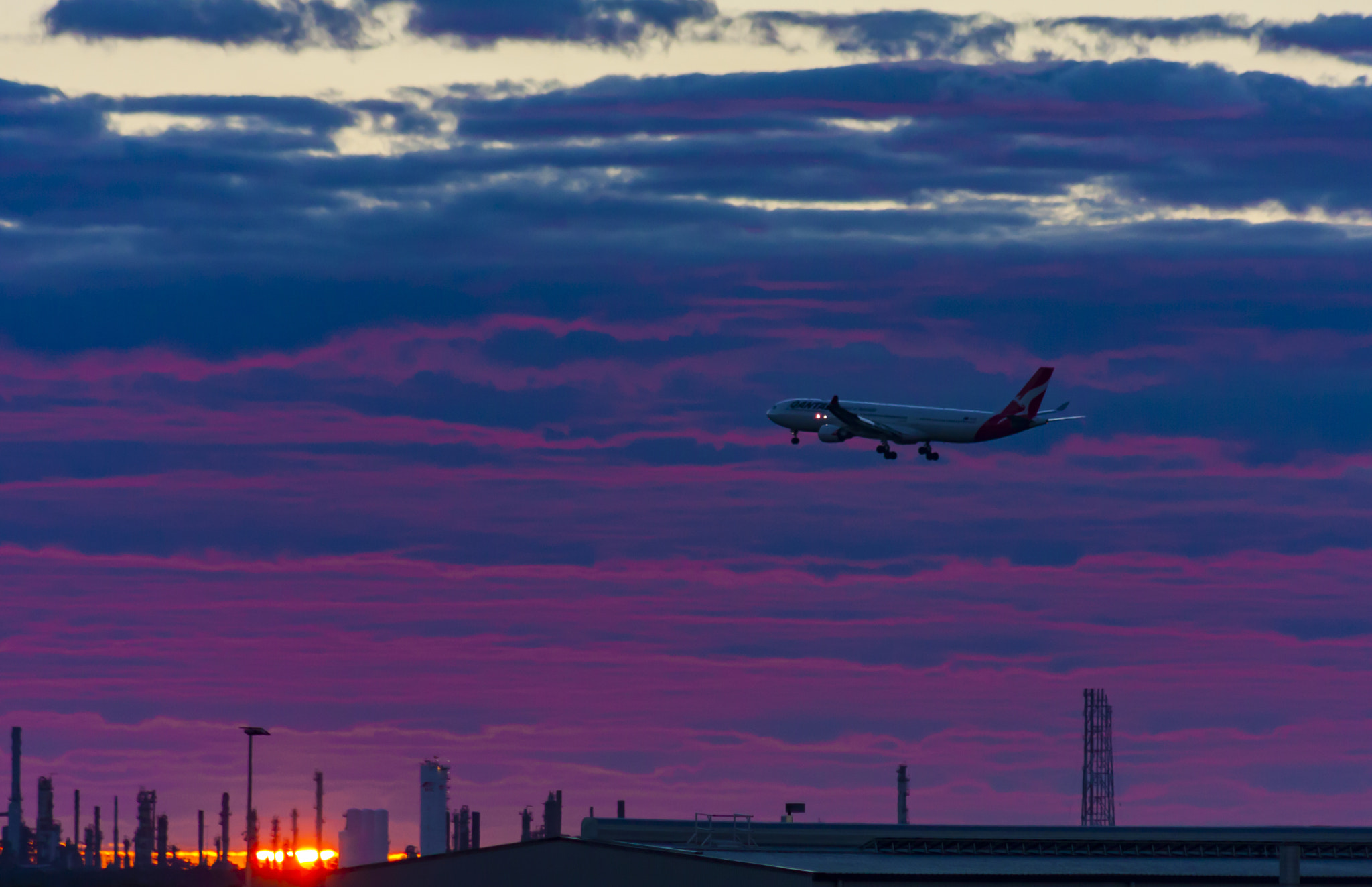 Canon EOS 40D + EF75-300mm f/4-5.6 sample photo. Aircraft landing at sunrise photography