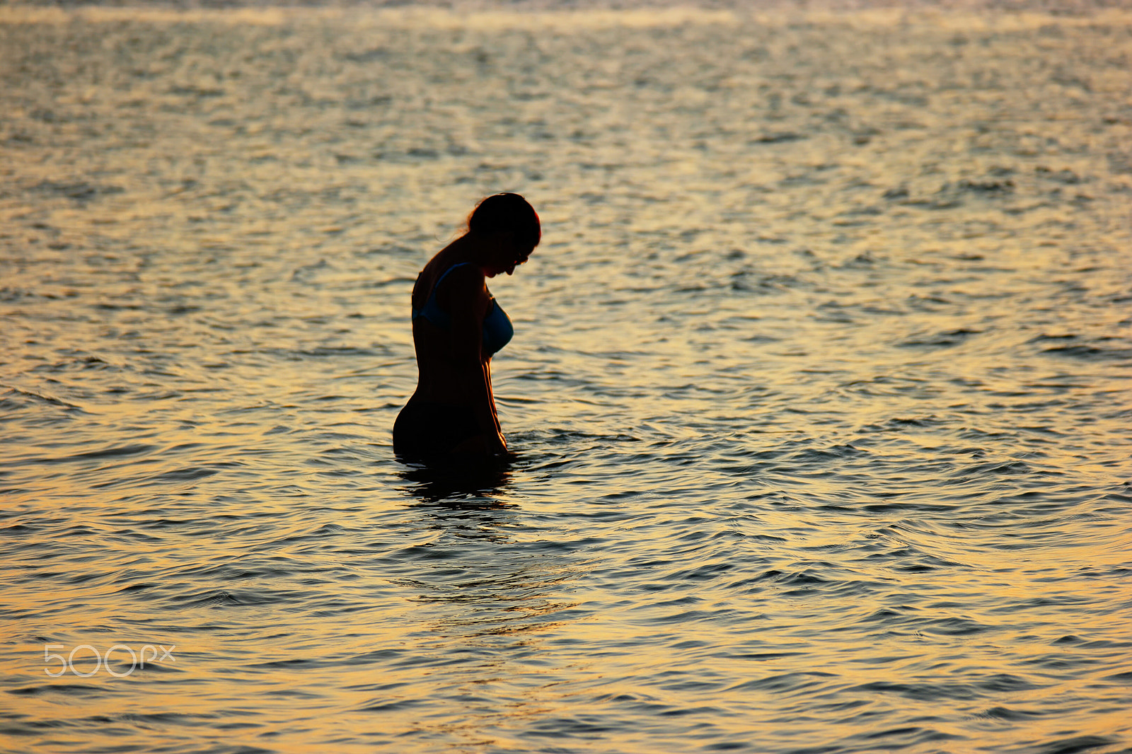 NX 50-200mm F4-5.6 sample photo. Adult woman standing in sea silhouette sunset time photography