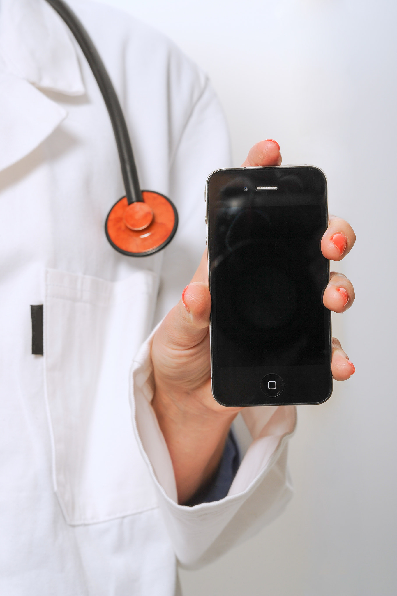 Nikon D3S + Nikon AF-S Nikkor 85mm F1.4G sample photo. Doctor using and presenting smartphone photography