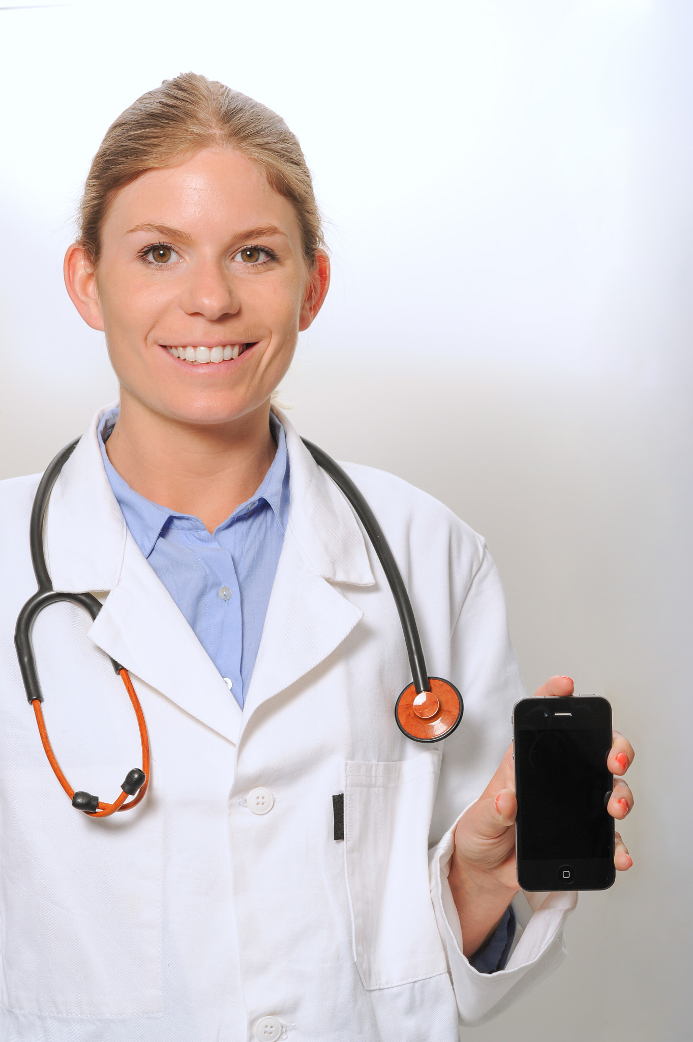 Nikon D3S + Nikon AF-S Nikkor 85mm F1.4G sample photo. Doctor using and presenting smartphone photography